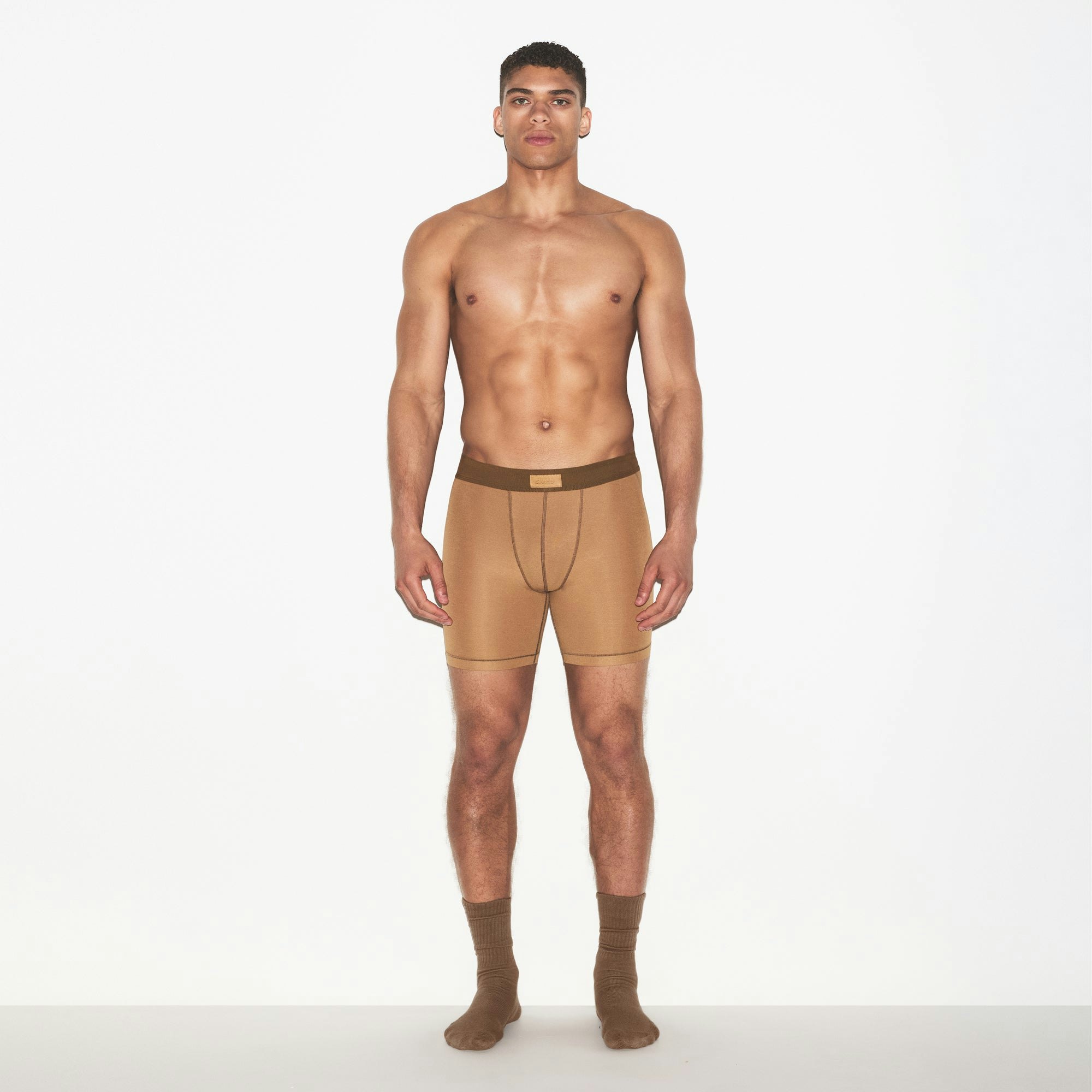 SKIMS COTTON MENS 5 INCH BOXER BRIEF 3-PACK | RUSSET MULTI ON A MODEL FRONT VIEW | FOCUS: 0.0, 1.0, 0.9
