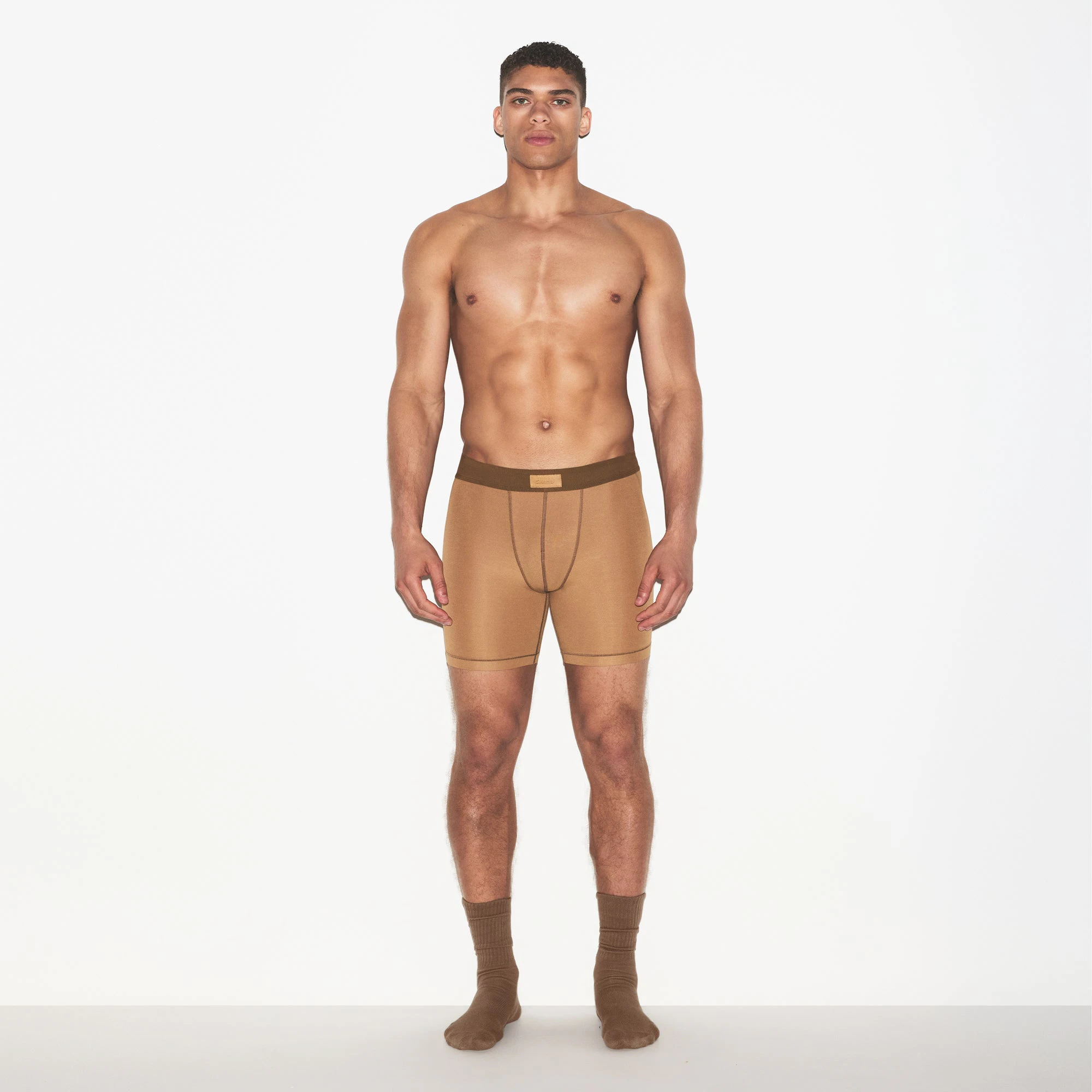 SKIMS COTTON MENS 5 INCH BOXER BRIEF 3-PACK | RUSSET MULTI ON A MODEL FRONT VIEW | FOCUS: 0.0, 1.0, 0.9