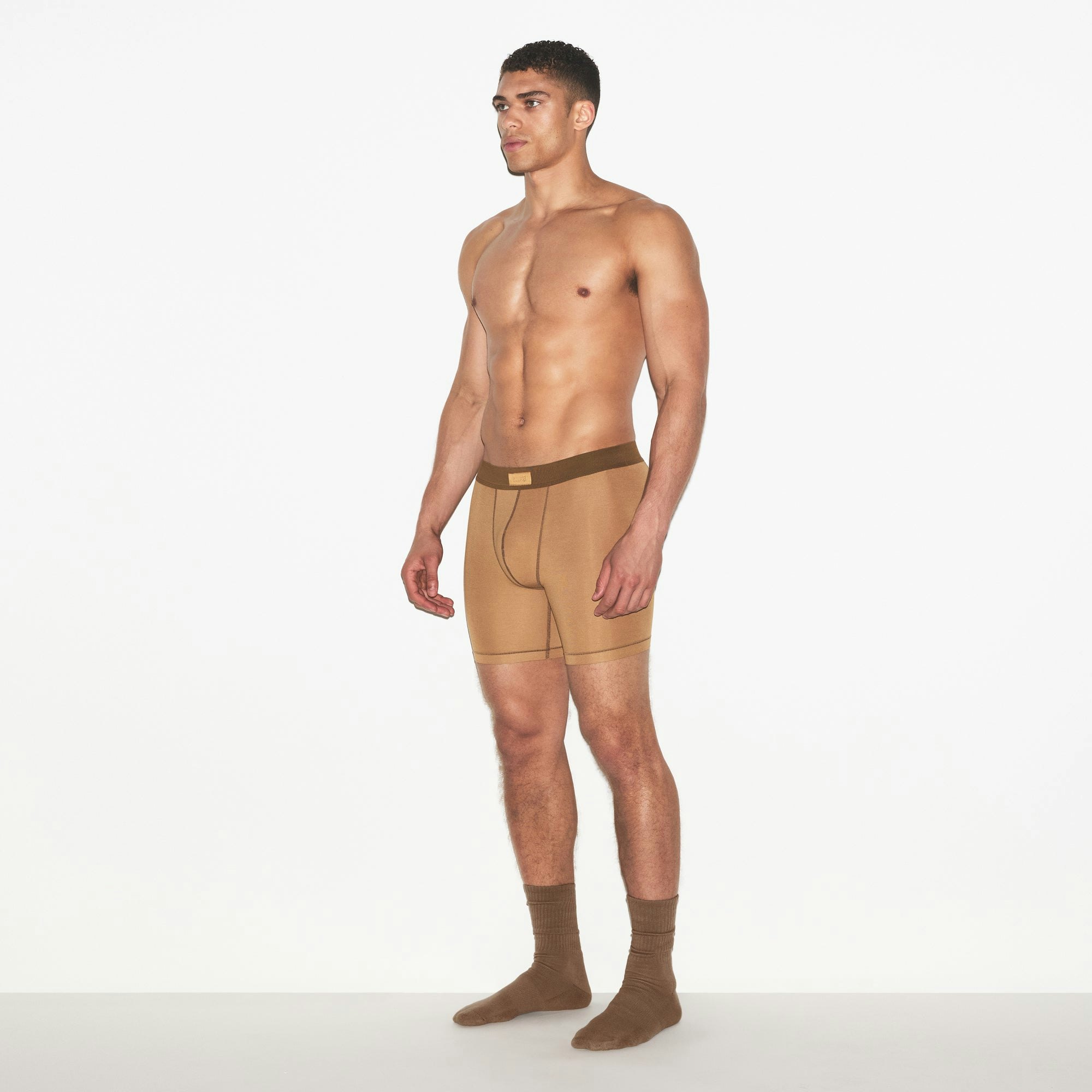 SKIMS COTTON MENS 5 INCH BOXER BRIEF 3-PACK | RUSSET MULTI ON A MODEL FRONT VIEW | FOCUS: 0.0, 1.0, 0.9