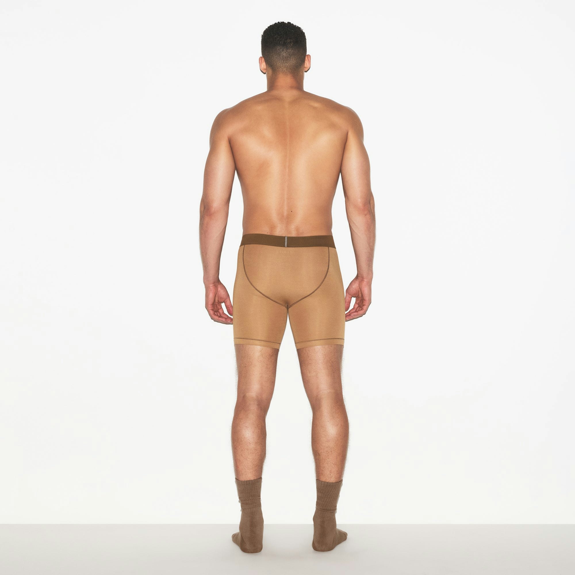 SKIMS COTTON MENS 5 INCH BOXER BRIEF 3-PACK | RUSSET MULTI ON A MODEL FRONT VIEW | FOCUS: 0.0, 1.0, 0.9