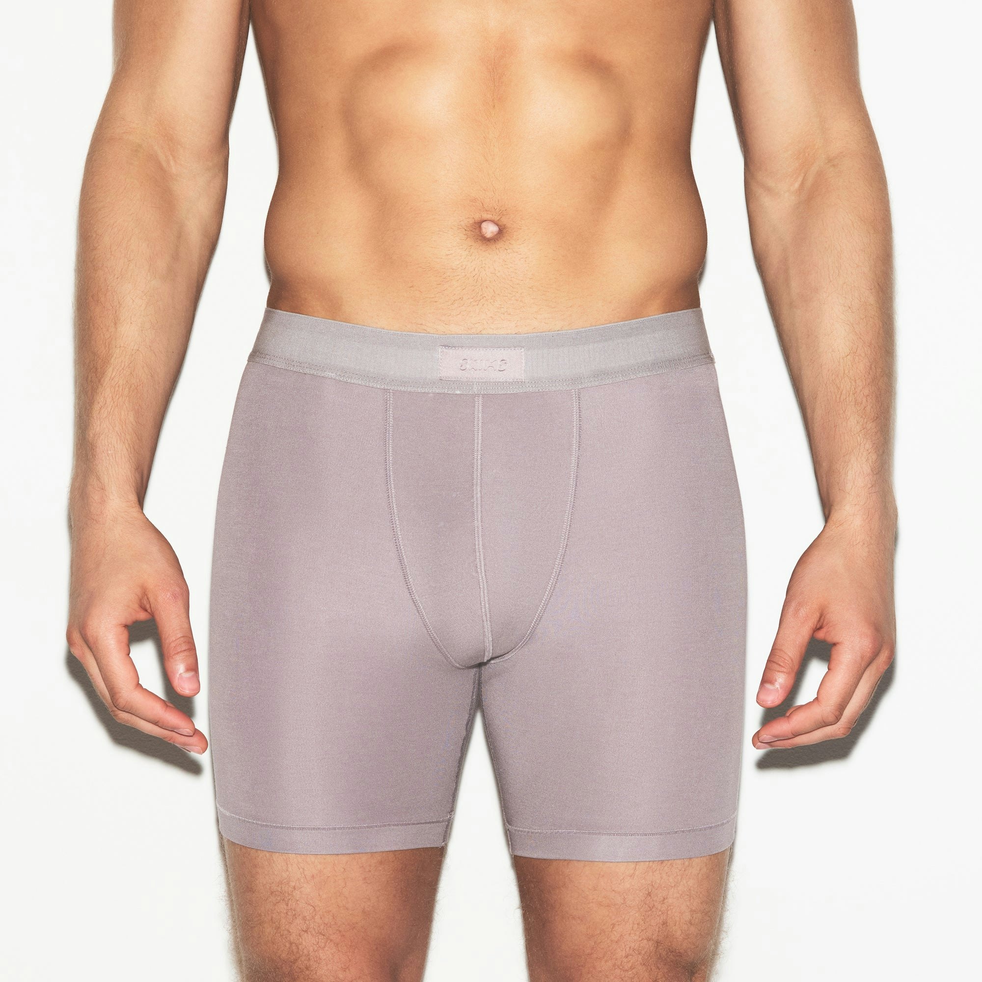 SKIMS COTTON MENS 5 INCH BOXER BRIEF 3-PACK | RUSSET MULTI ON A MODEL SIDE VIEW | FOCUS: 0.0, 1.0, 0.9