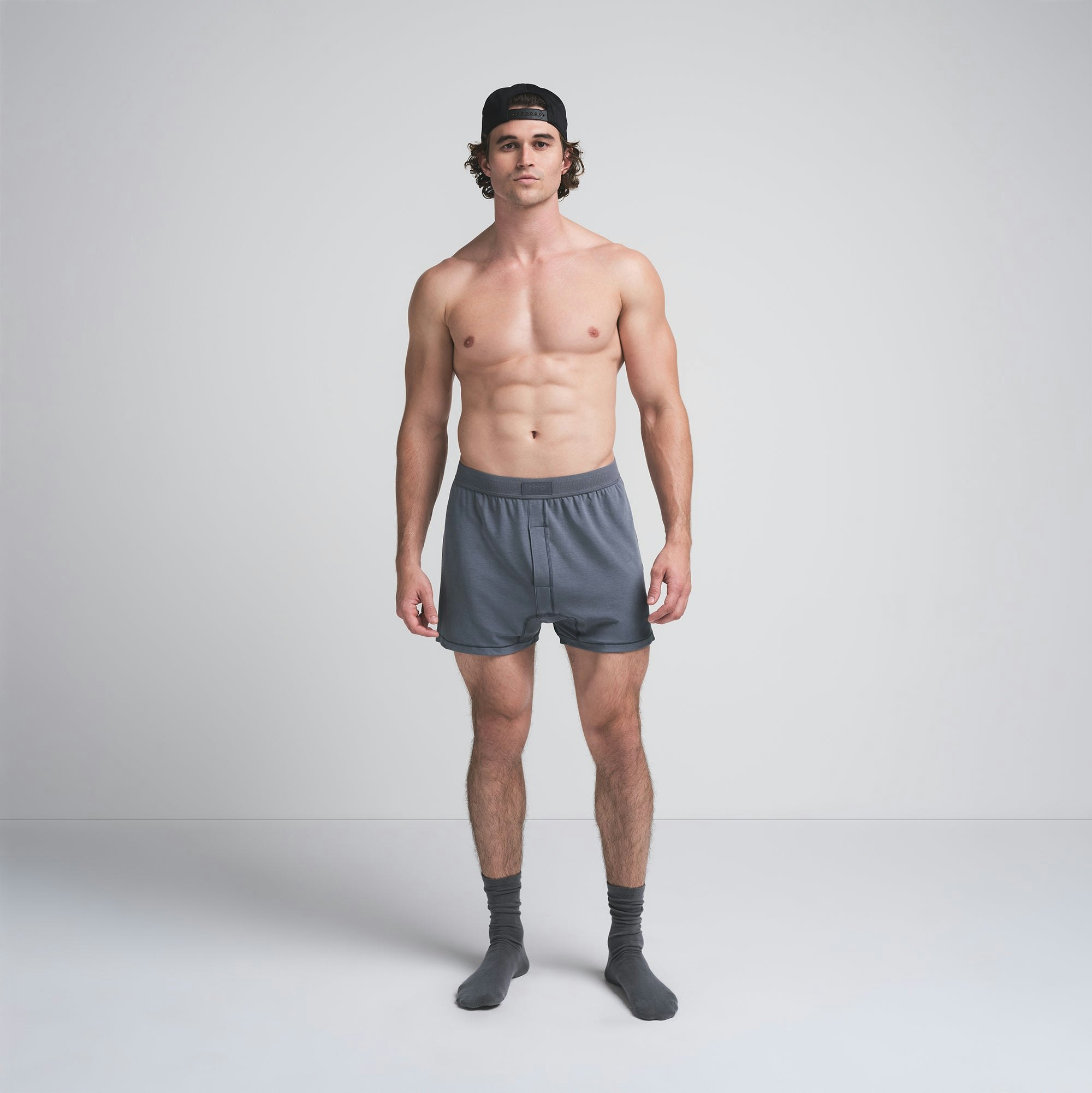 SKIMS COTTON MENS KNIT BOXER | STEEL BLUE ON A MODEL FRONT VIEW | FOCUS: 0.0, 1.0, 0.9