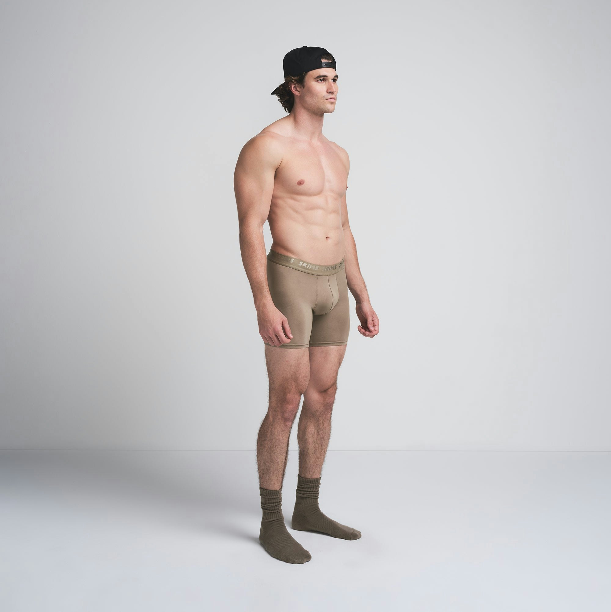 SKIMS STRETCH MENS 5 INCH BOXER BRIEF 5-PACK | DESERT INDIGO MULTI ON A MODEL SIDE VIEW