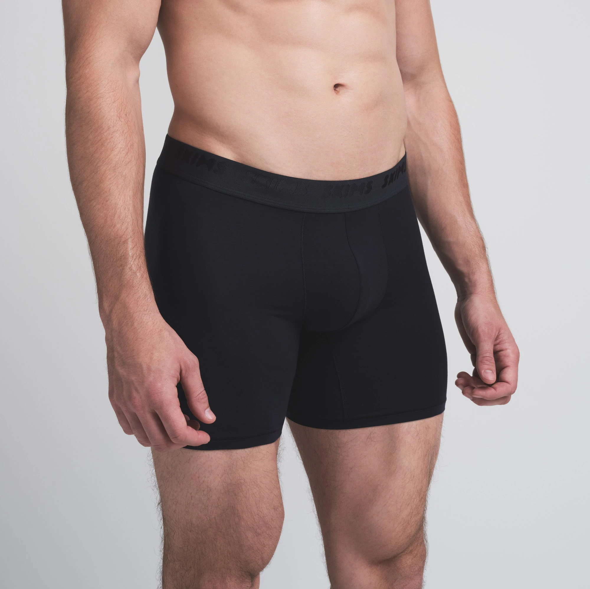 SKIMS STRETCH MENS 5 INCH BOXER BRIEF 5-PACK | DESERT INDIGO MULTI ON A MODEL SIDE VIEW