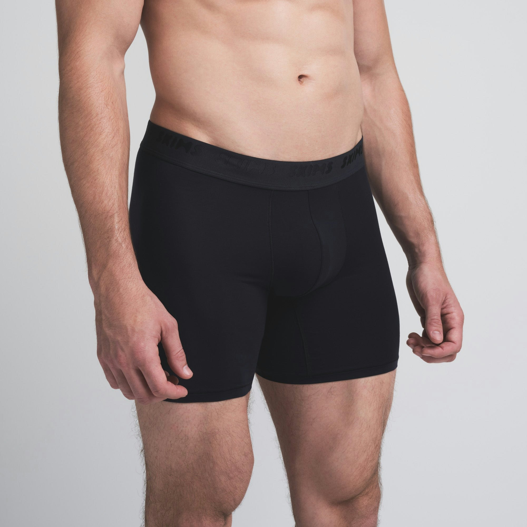 SKIMS STRETCH MENS 5 INCH BOXER BRIEF 5-PACK | DESERT INDIGO MULTI ON A MODEL SIDE VIEW