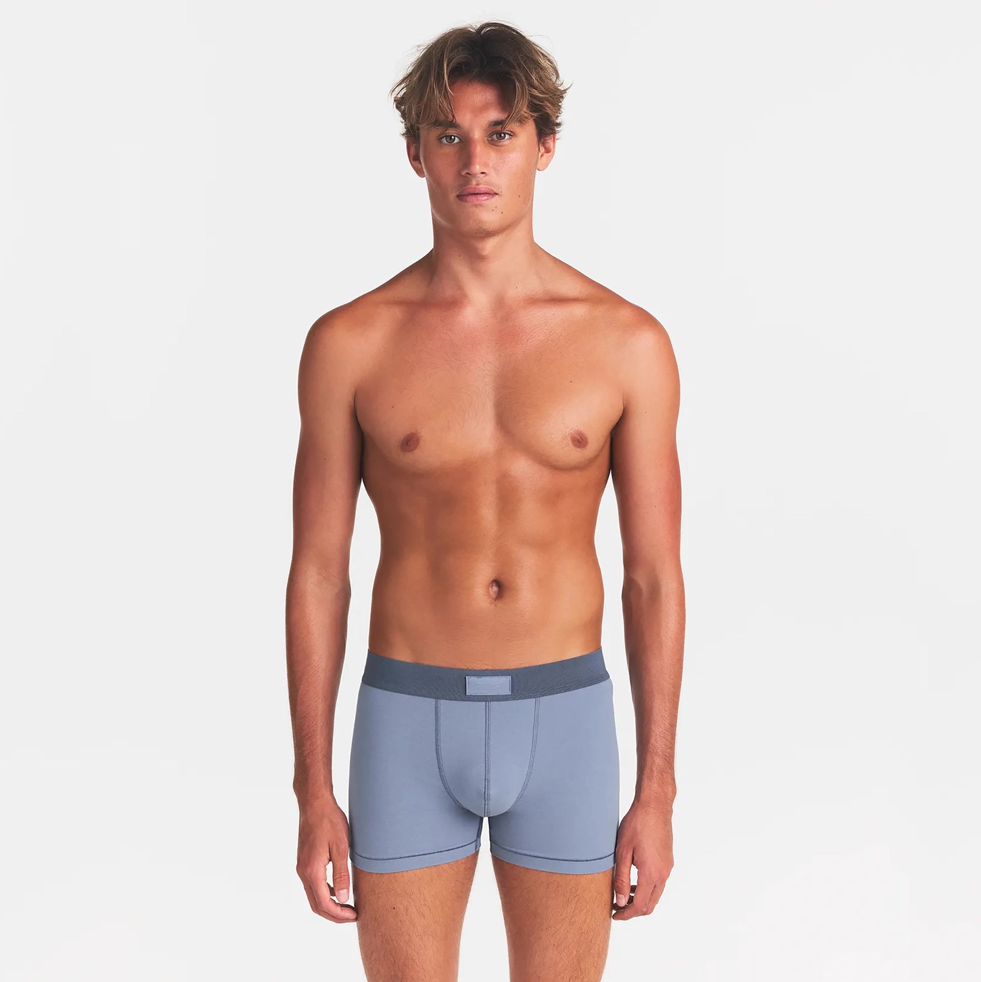 SKIMS COTTON MENS 3" BOXER BRIEF 5-PACK | ATMOSPHERE MULTI ON A MODEL FRONT VIEW