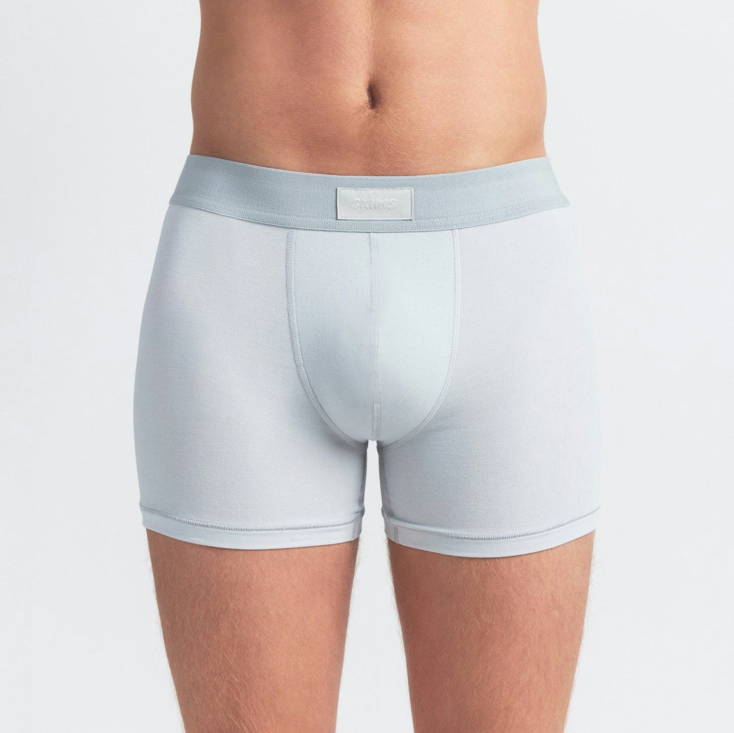 SKIMS COTTON MENS 3" BOXER BRIEF 5-PACK | BLUE BLACK STONE MULTI ON A MODEL SIDE VIEW @ | FOCUS: 0.0, 1.0, 0.9