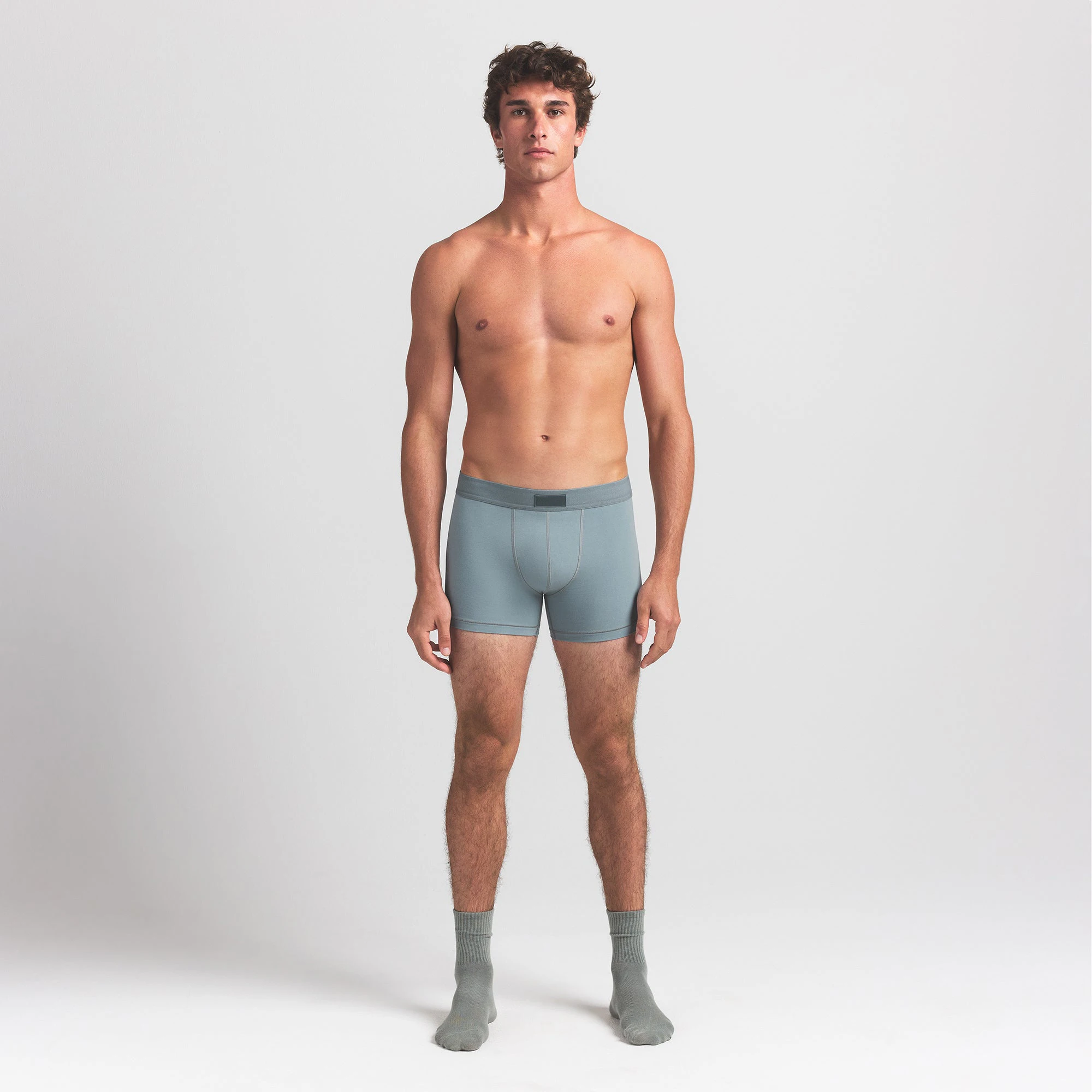 SKIMS COTTON MENS 3" BOXER BRIEF 5-PACK | VERDANT SKY MULTI ON A MODEL FRONT VIEW @ | FOCUS: 0.0, 1.0, 0.9