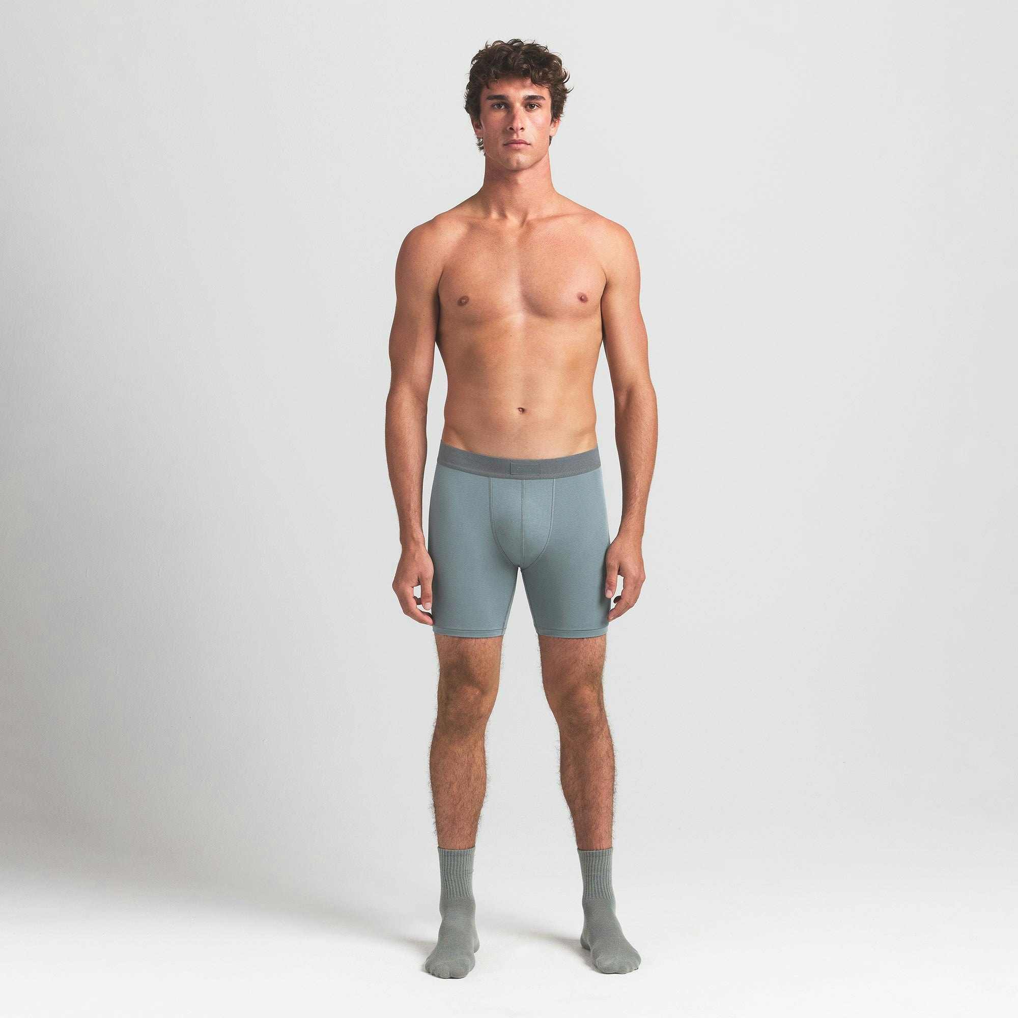 SKIMS COTTON MENS 5" BOXER BRIEF 5-PACK | VERDANT SKY MULTI ON A MODEL FRONT VIEW @ | FOCUS: 0.0, 1.0, 0.9