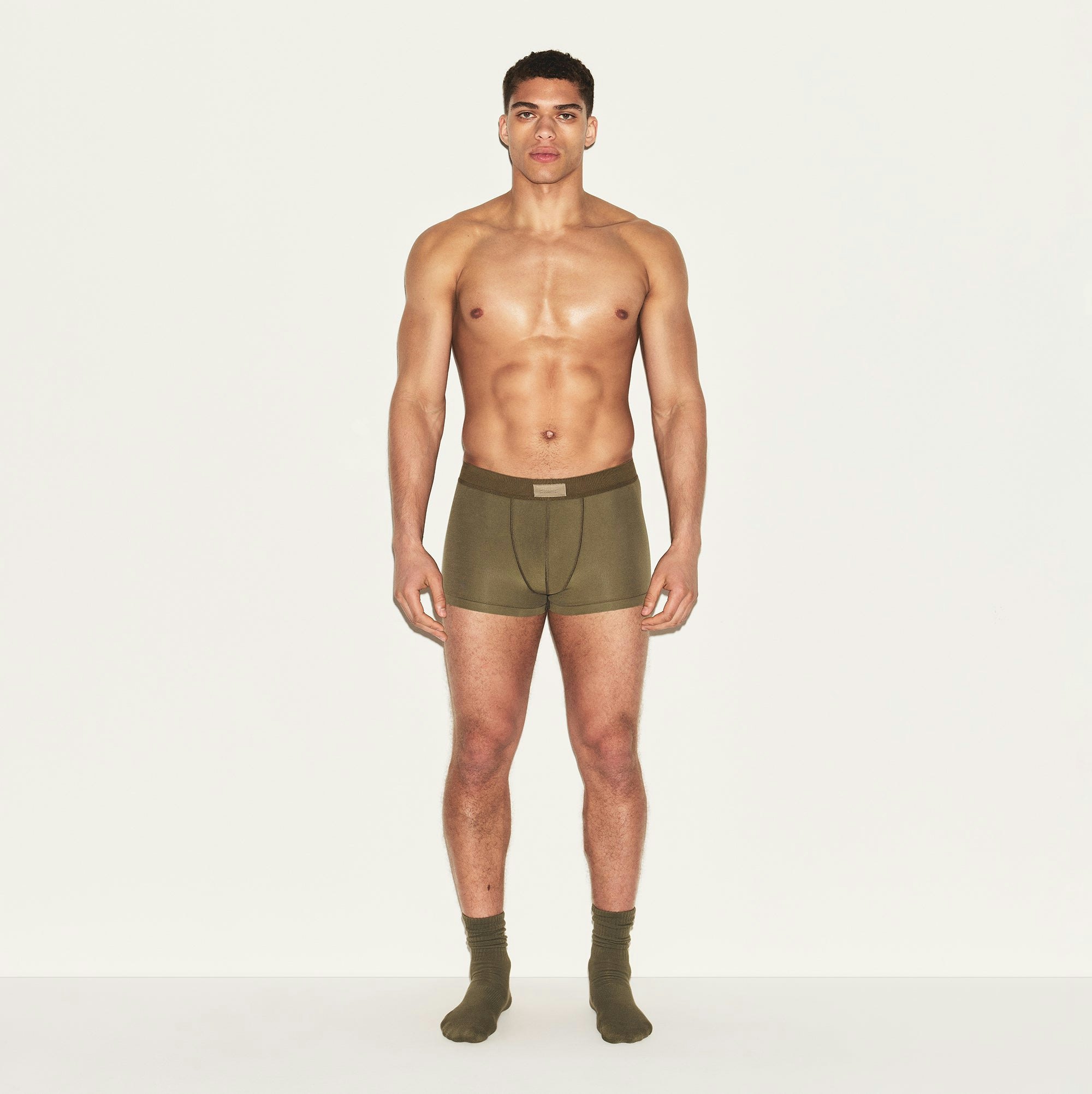 SKIMS COTTON MENS TRUNK | ARMY ON A MODEL FRONT VIEW | FOCUS: 0.0, 1.0, 0.9