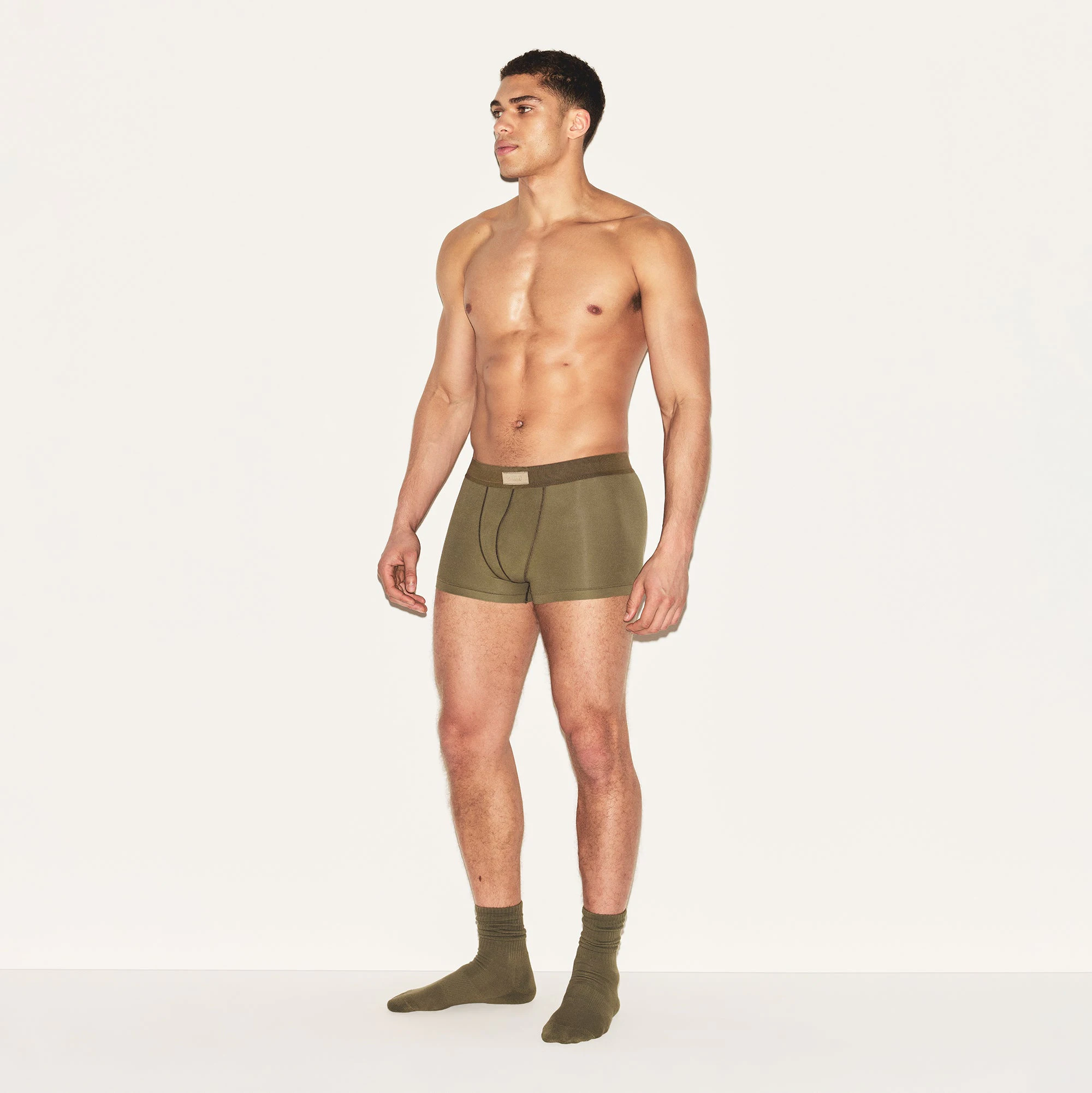 SKIMS COTTON MENS TRUNK | ARMY ON A MODEL SIDE VIEW | FOCUS: 0.0, 1.0, 0.9