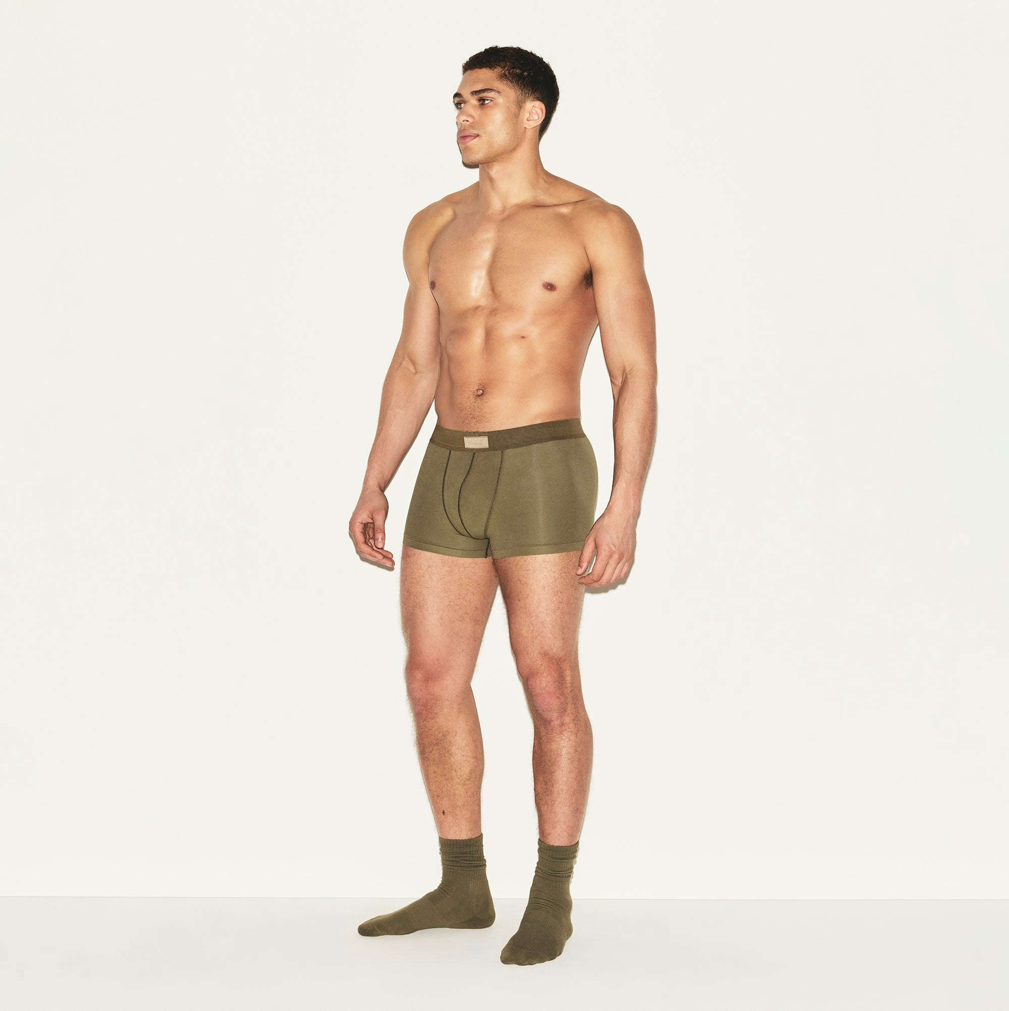 SKIMS COTTON MENS TRUNK | ARMY ON A MODEL SIDE VIEW | FOCUS: 0.0, 1.0, 0.9