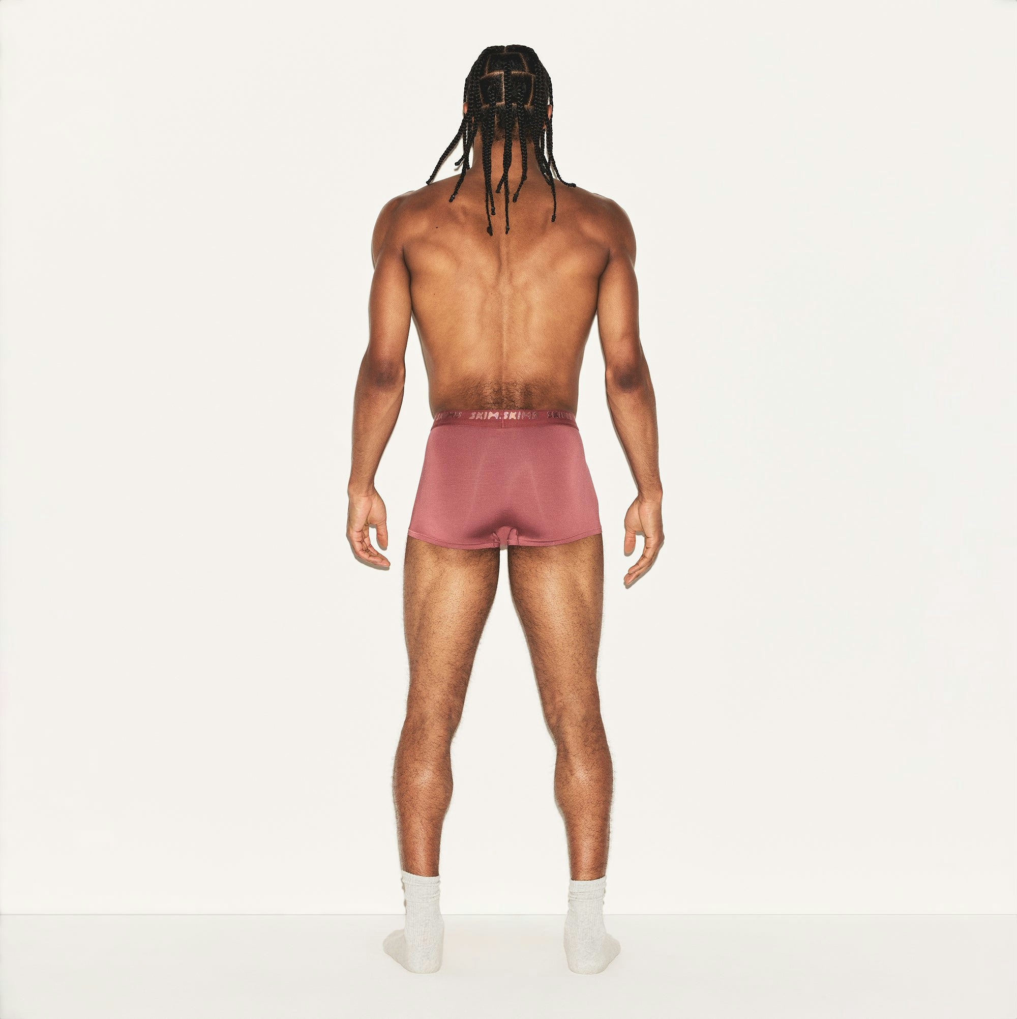 SKIMS STRETCH MENS TRUNK | CORDOVAN ON A MODEL BACK VIEW | FOCUS: 0.0, 1.0, 0.9