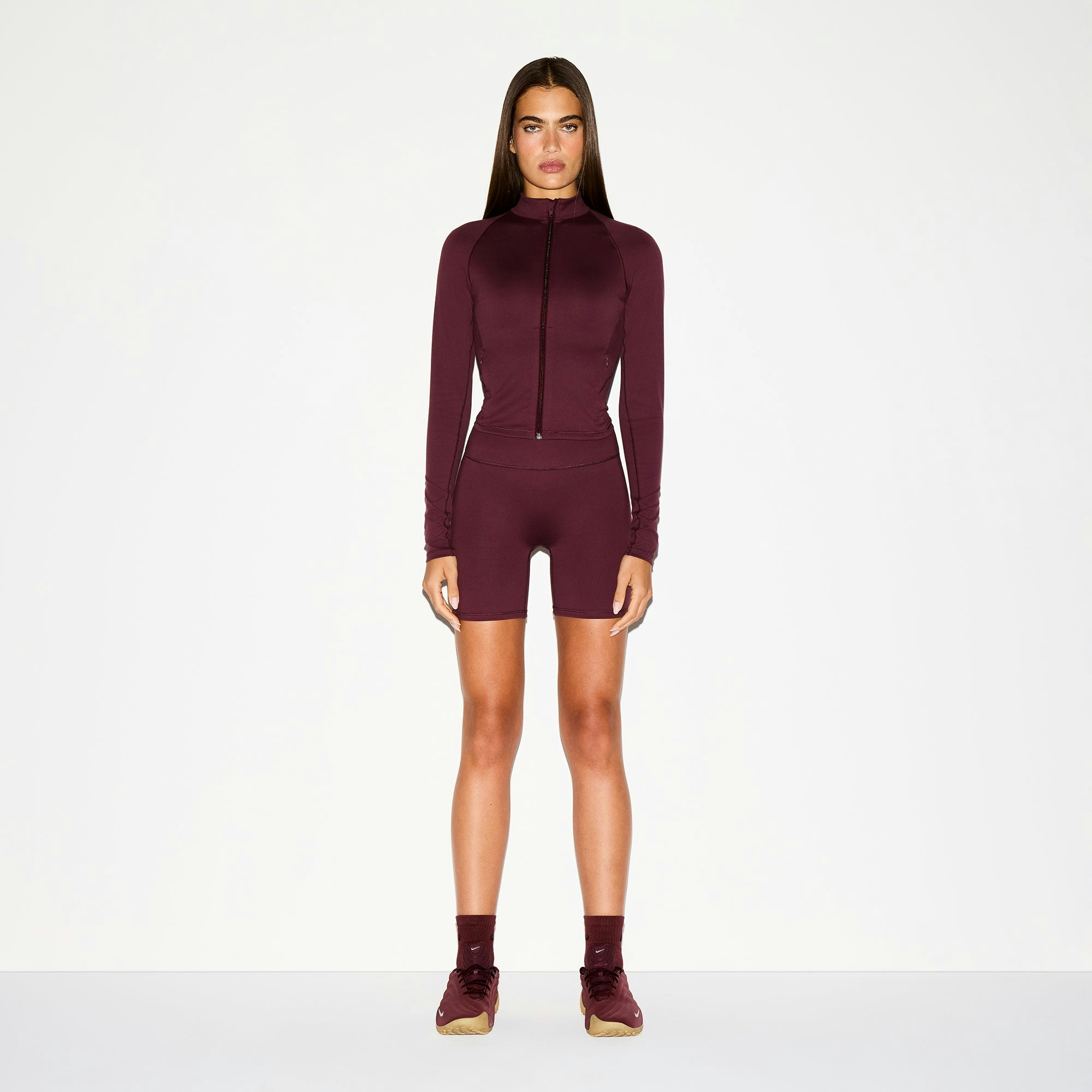 NikeSKIMS MATTE 5" BIKER SHORT | CURRANT ON A MODEL FRONT VIEW @ | FOCUS: 0.0, 1.0, 0.9