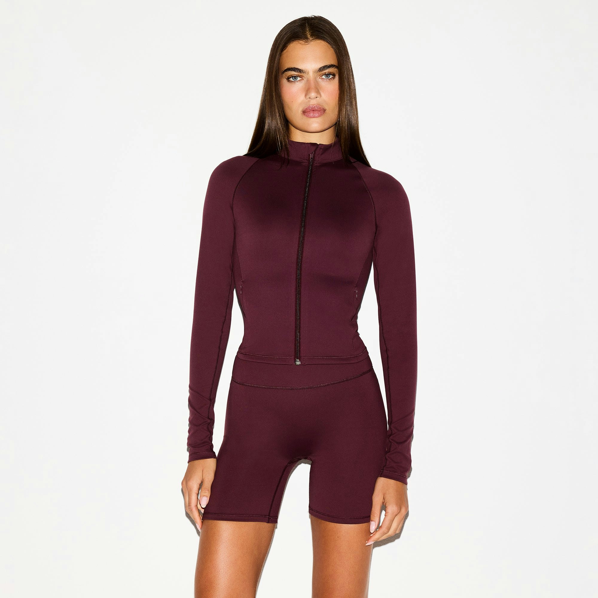 NikeSKIMS MATTE 5" BIKER SHORT | CURRANT ON A MODEL FRONT VIEW @ | FOCUS: 0.0, 1.0, 0.9