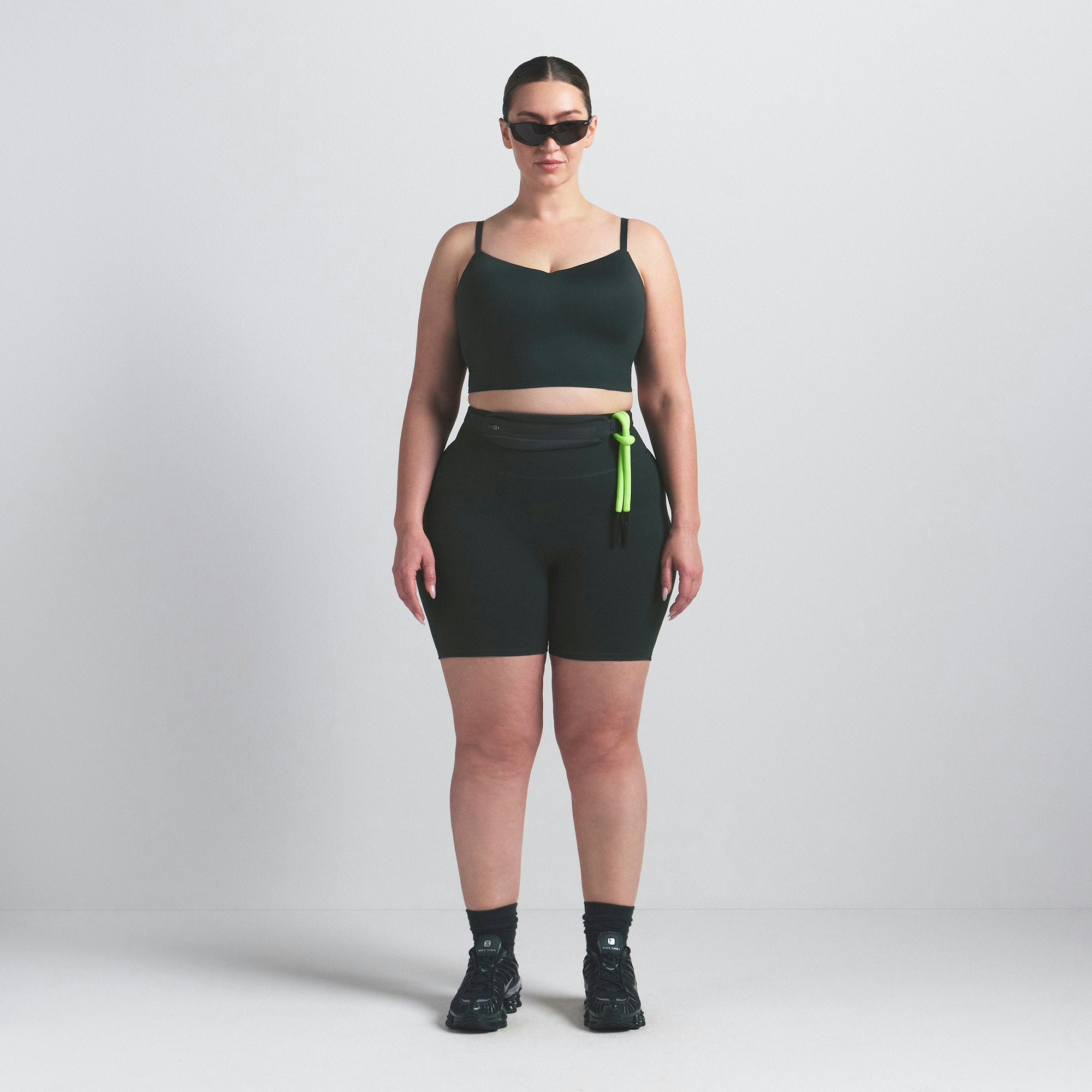 NikeSKIMS MATTE 5" BIKER SHORT | DARK TEAL ON A MODEL FRONT VIEW @ | FOCUS: 0.0, 1.0, 0.9