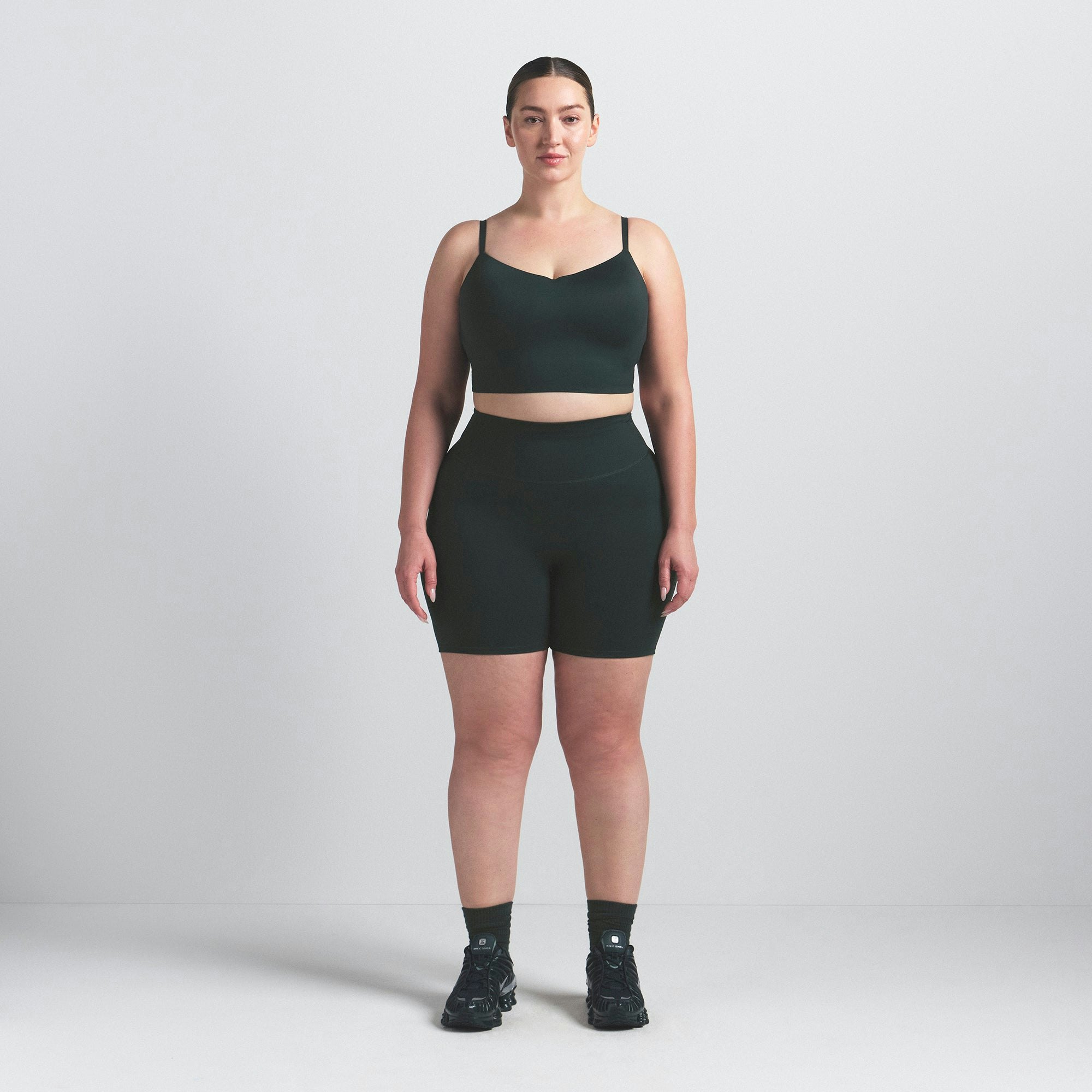 NikeSKIMS MATTE 5" BIKER SHORT | DARK TEAL ON A MODEL FRONT VIEW @ | FOCUS: 0.0, 1.0, 0.9