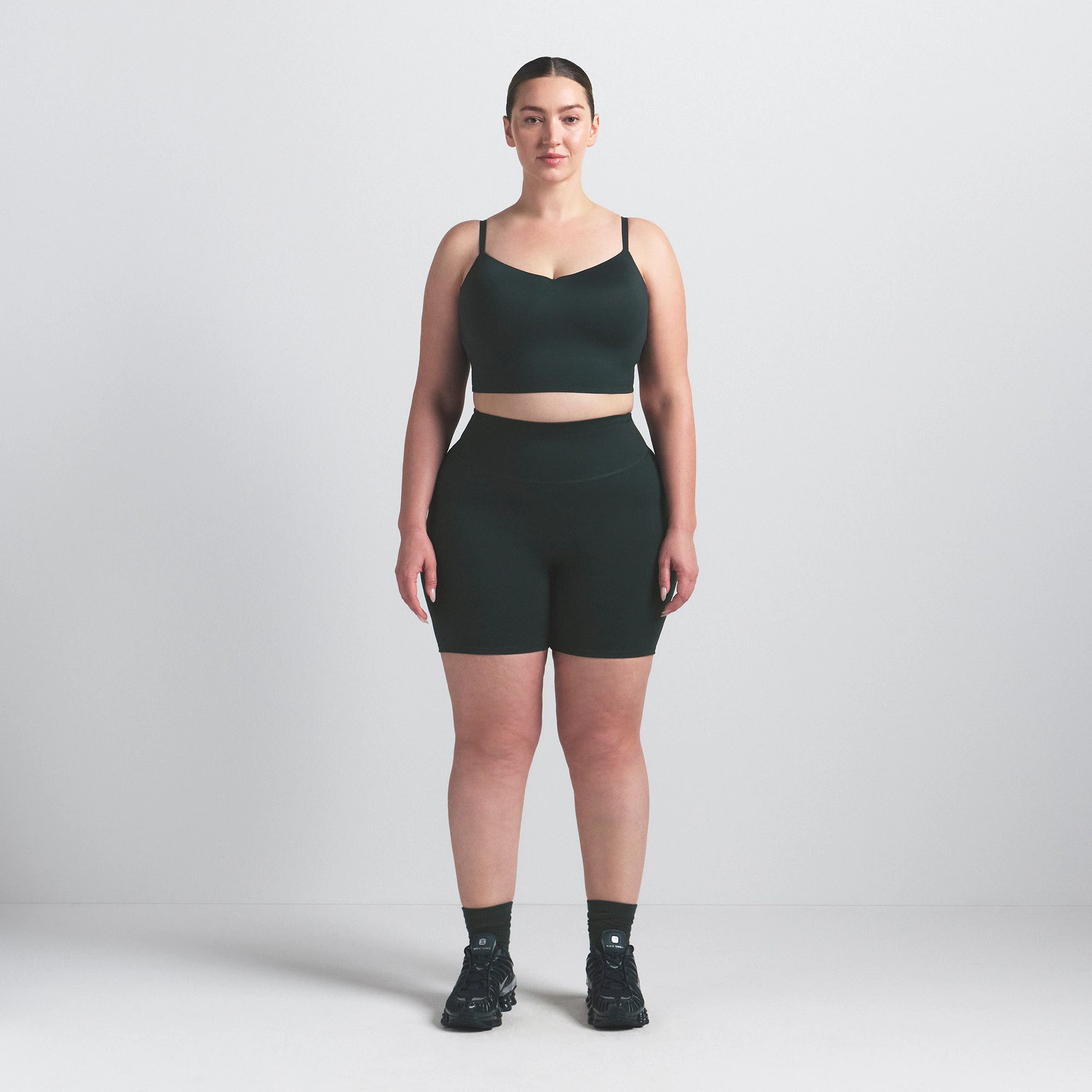 NikeSKIMS MATTE 5" BIKER SHORT | DARK TEAL ON A MODEL FRONT VIEW @ | FOCUS: 0.0, 1.0, 0.9