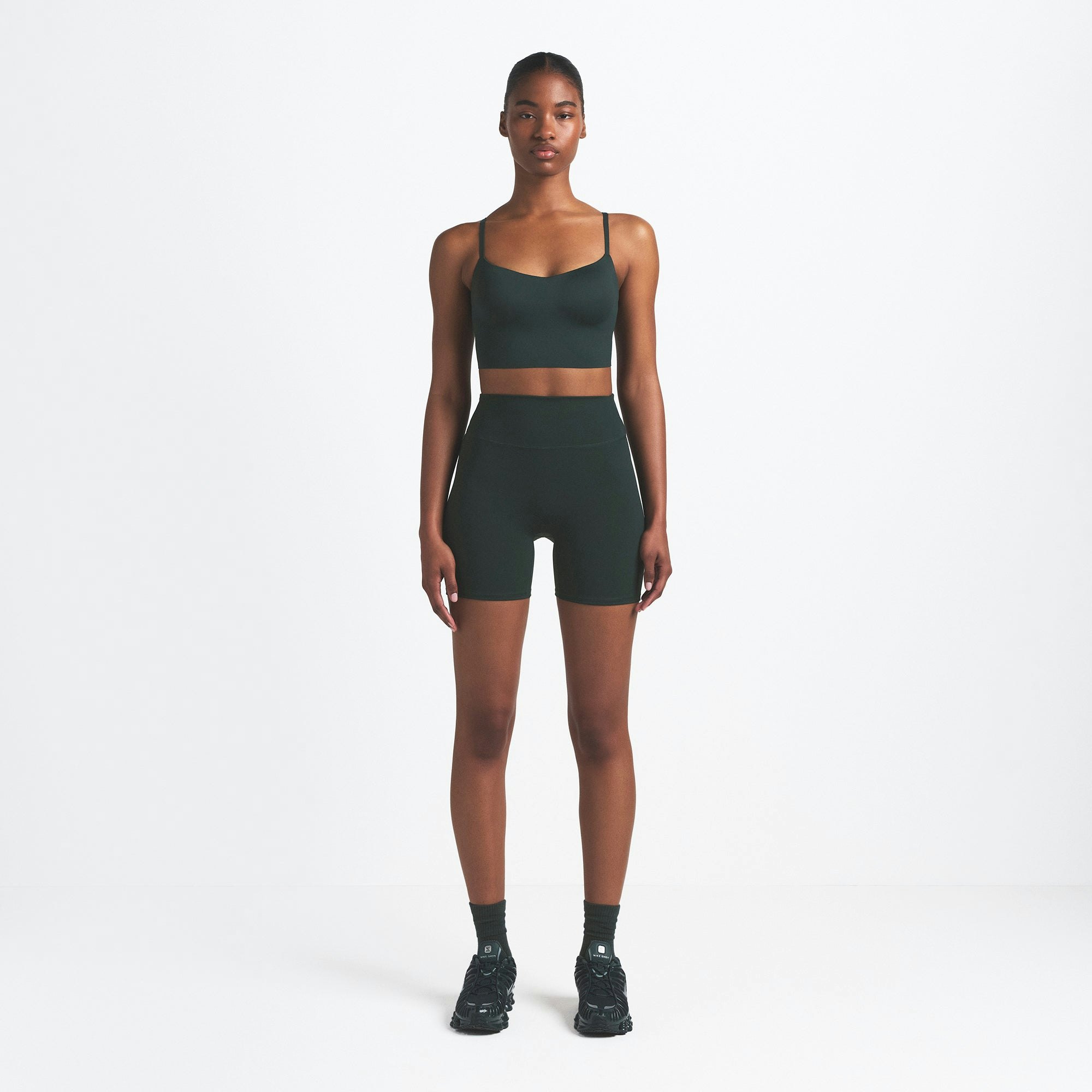 NikeSKIMS MATTE 5" BIKER SHORT | DARK TEAL ON A MODEL FRONT VIEW @ | FOCUS: 0.0, 1.0, 0.9