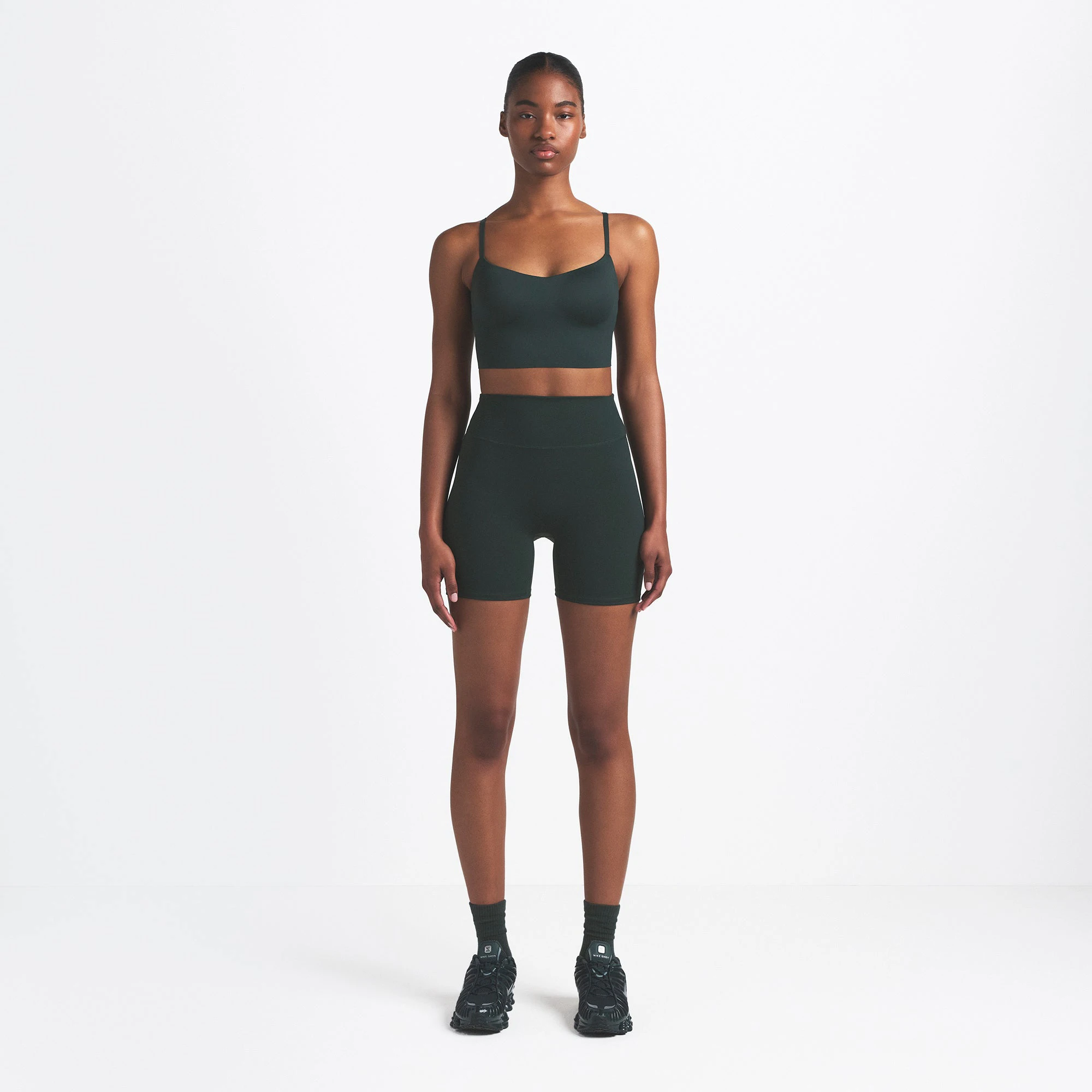 NikeSKIMS MATTE 5" BIKER SHORT | DARK TEAL ON A MODEL FRONT VIEW @ | FOCUS: 0.0, 1.0, 0.9