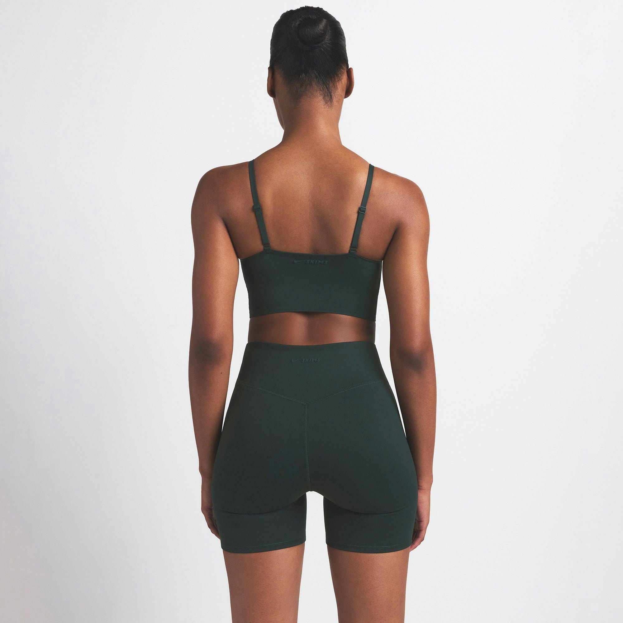 NikeSKIMS MATTE 5" BIKER SHORT | DARK TEAL ON A MODEL SIDE VIEW @ | FOCUS: 0.0, 1.0, 0.9