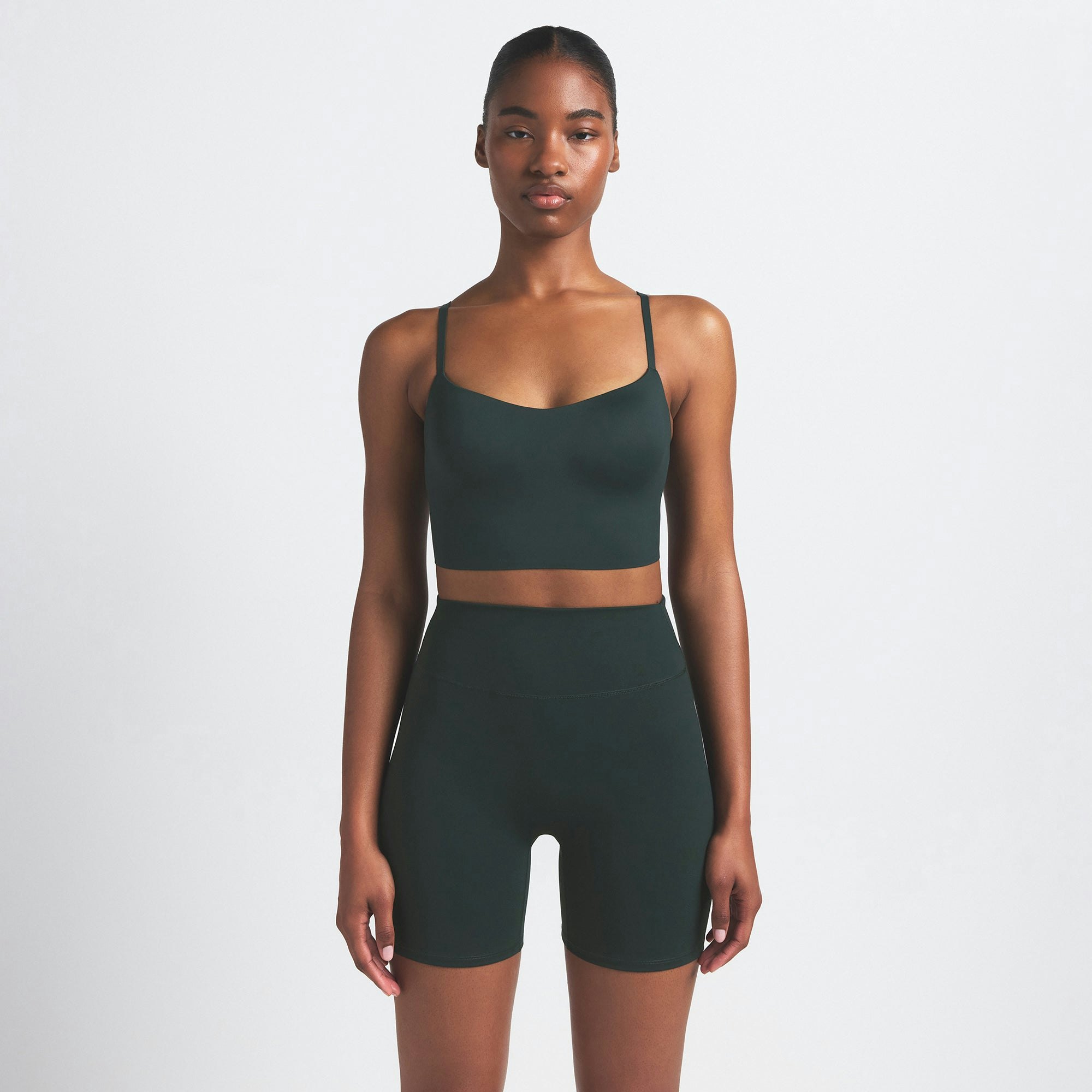 NikeSKIMS MATTE 5" BIKER SHORT | DARK TEAL ON A MODEL SIDE VIEW @ | FOCUS: 0.0, 1.0, 0.9