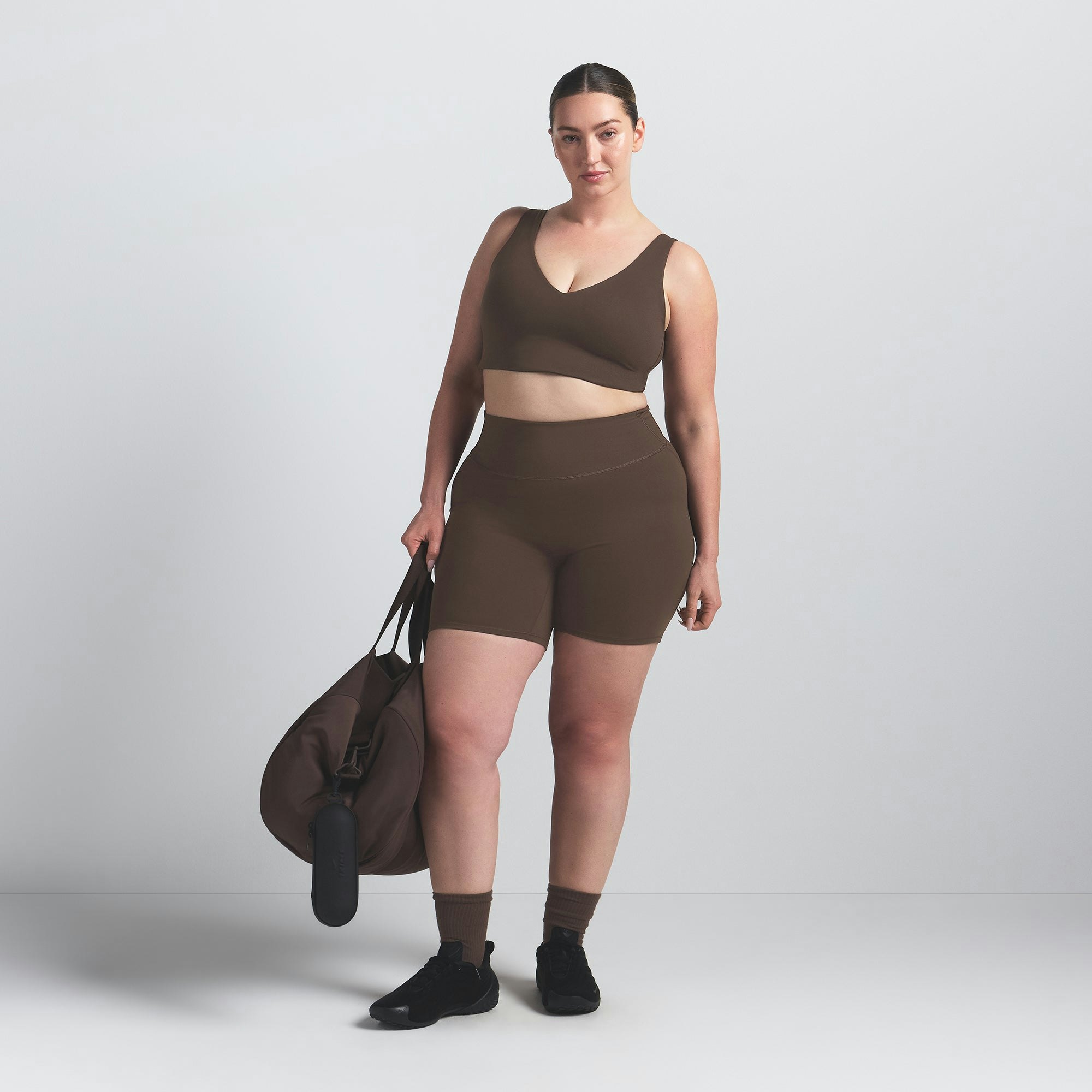 NikeSKIMS MATTE 5" BIKER SHORT | DARK SEPIA ON A MODEL FRONT VIEW