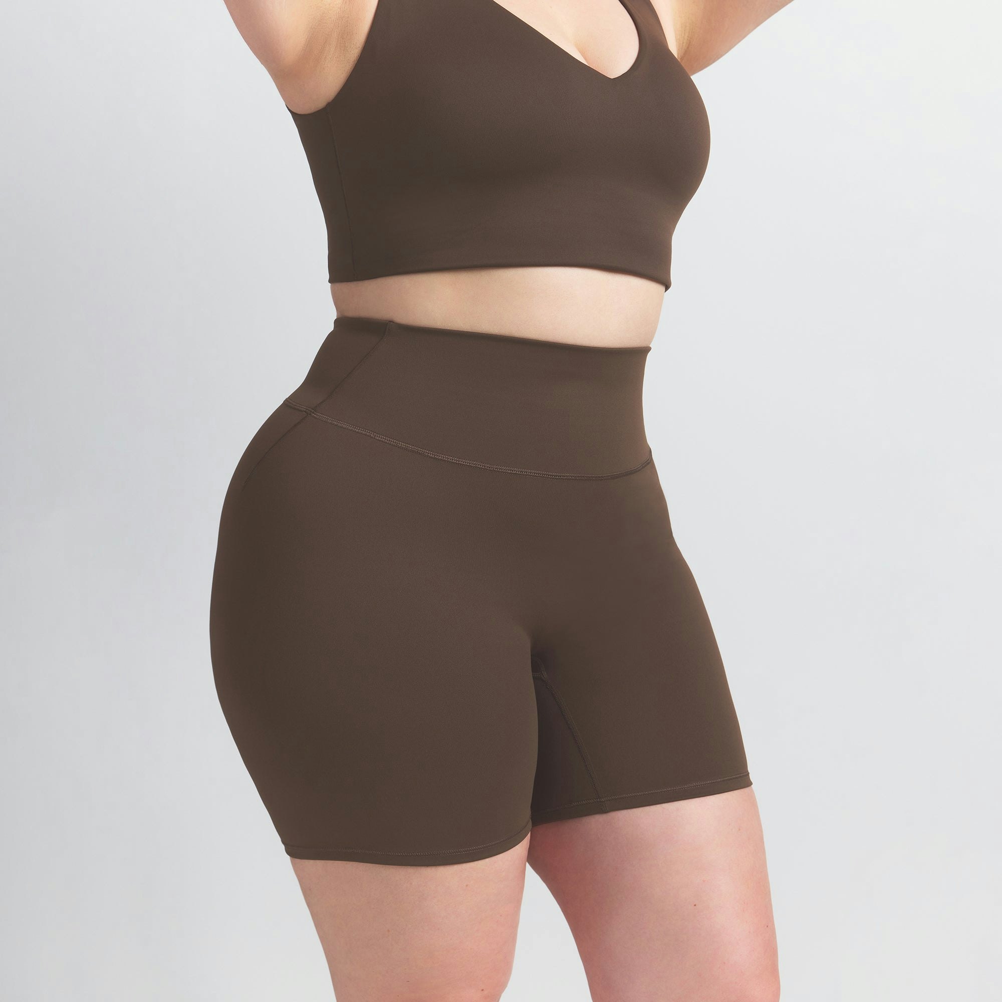 NikeSKIMS MATTE 5" BIKER SHORT | DARK SEPIA ON A MODEL SIDE VIEW