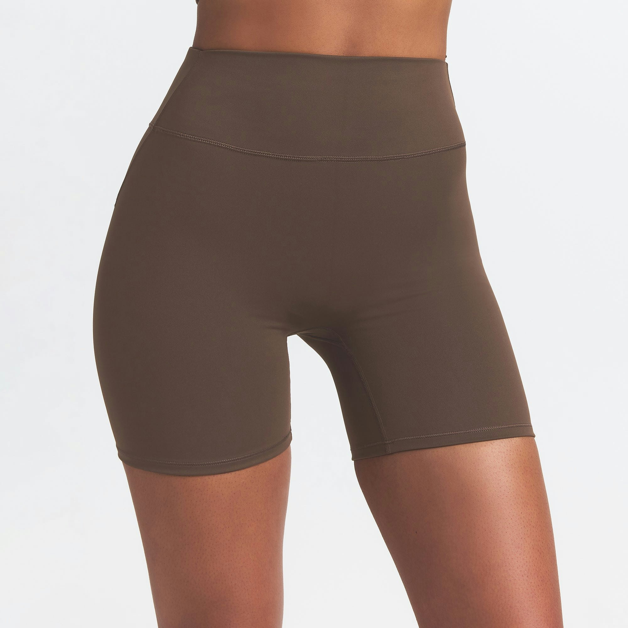 NikeSKIMS MATTE 5" BIKER SHORT | DARK SEPIA ON A MODEL FRONT VIEW