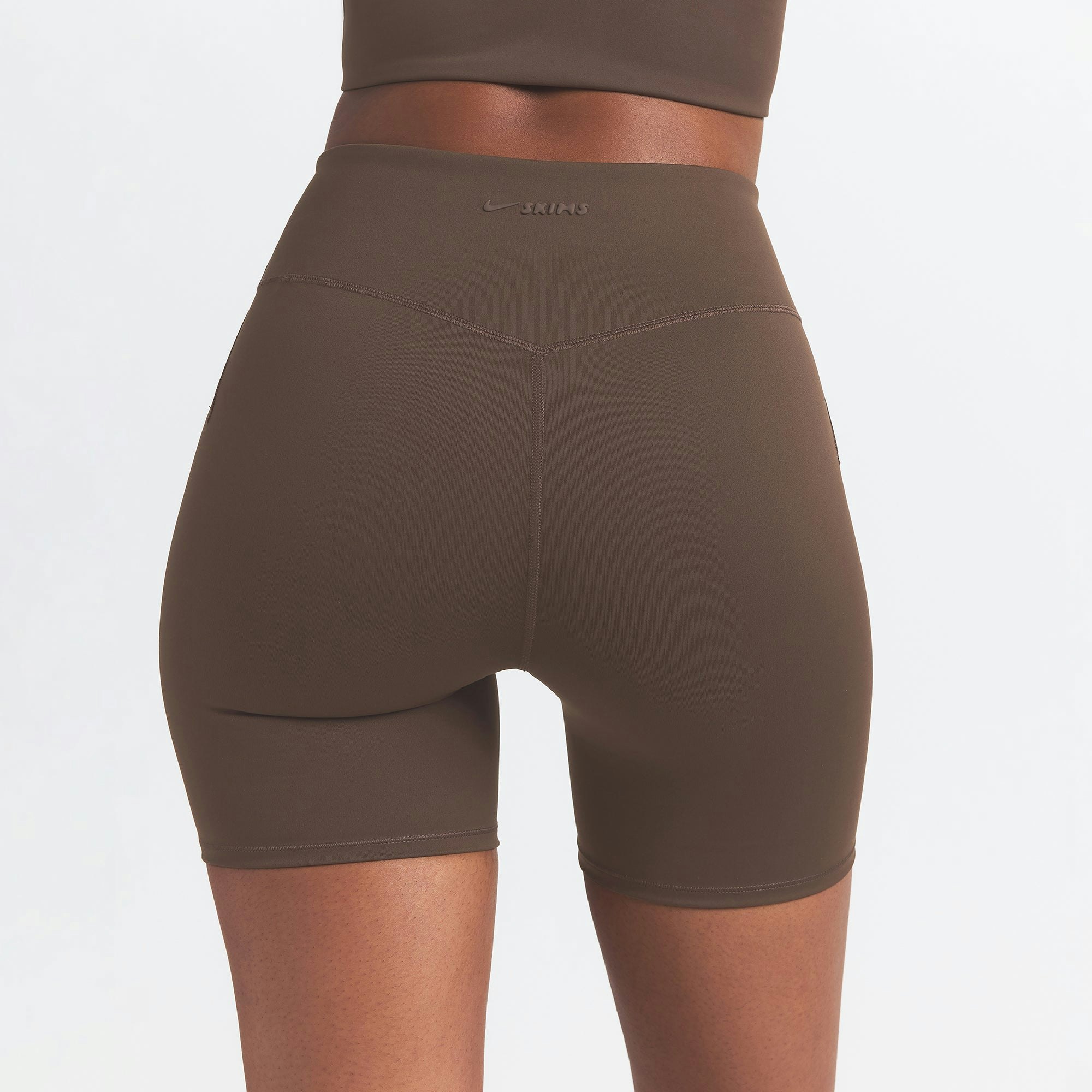 NikeSKIMS MATTE 5" BIKER SHORT | DARK SEPIA ON A MODEL BACK VIEW
