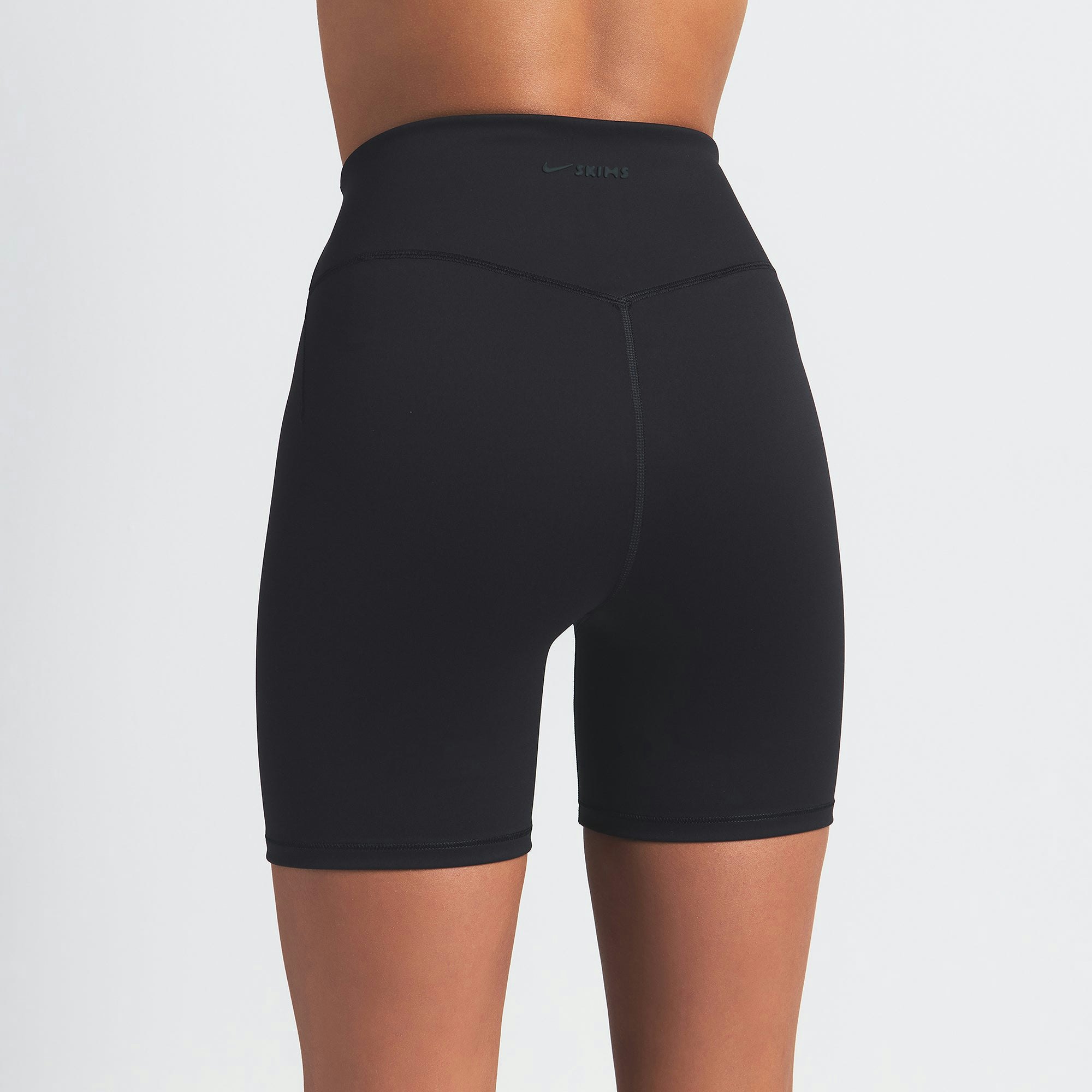 NikeSKIMS MATTE 5" BIKER SHORT | OBSIDIAN ON A MODEL BACK VIEW