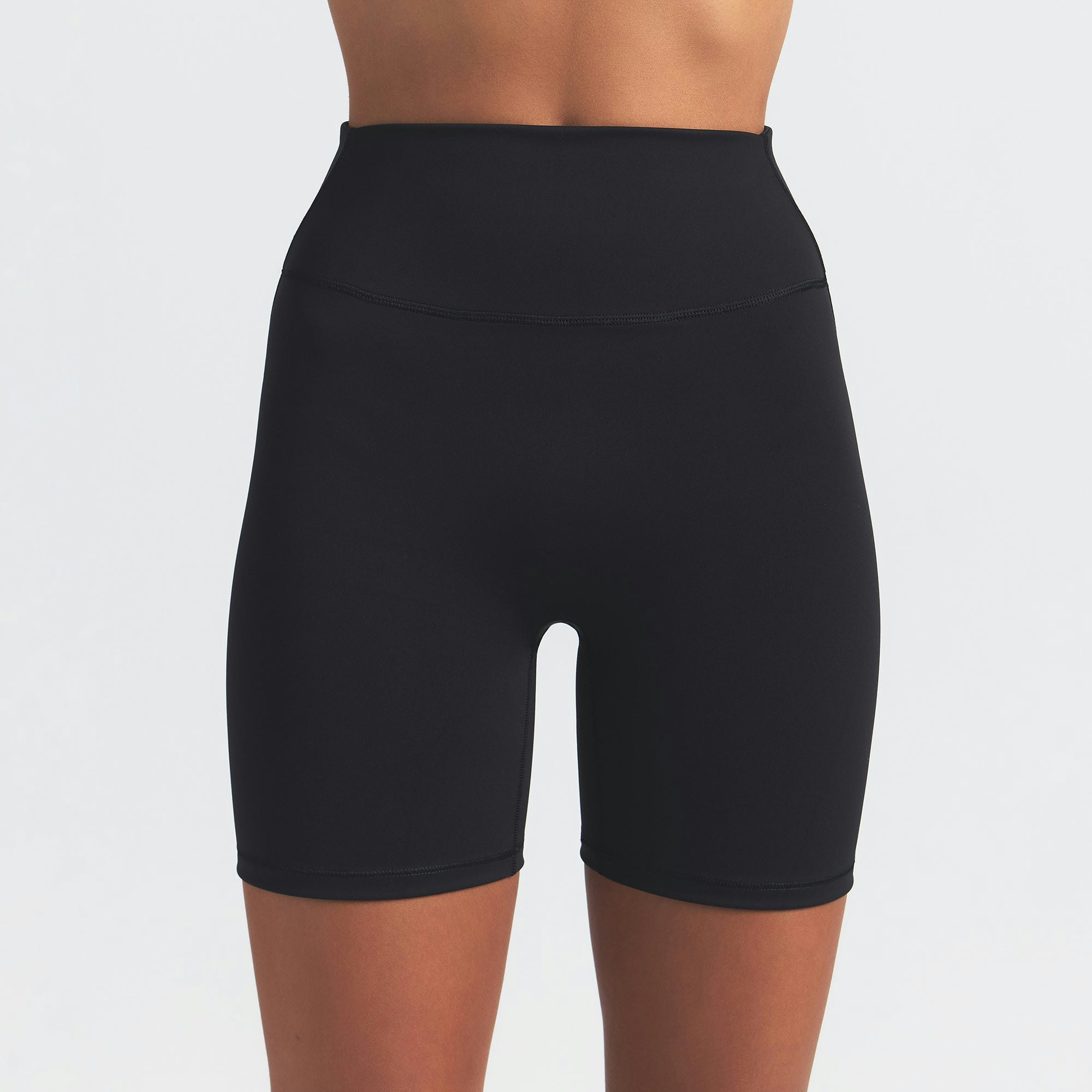 NikeSKIMS MATTE 5" BIKER SHORT | OBSIDIAN ON A MODEL FRONT VIEW