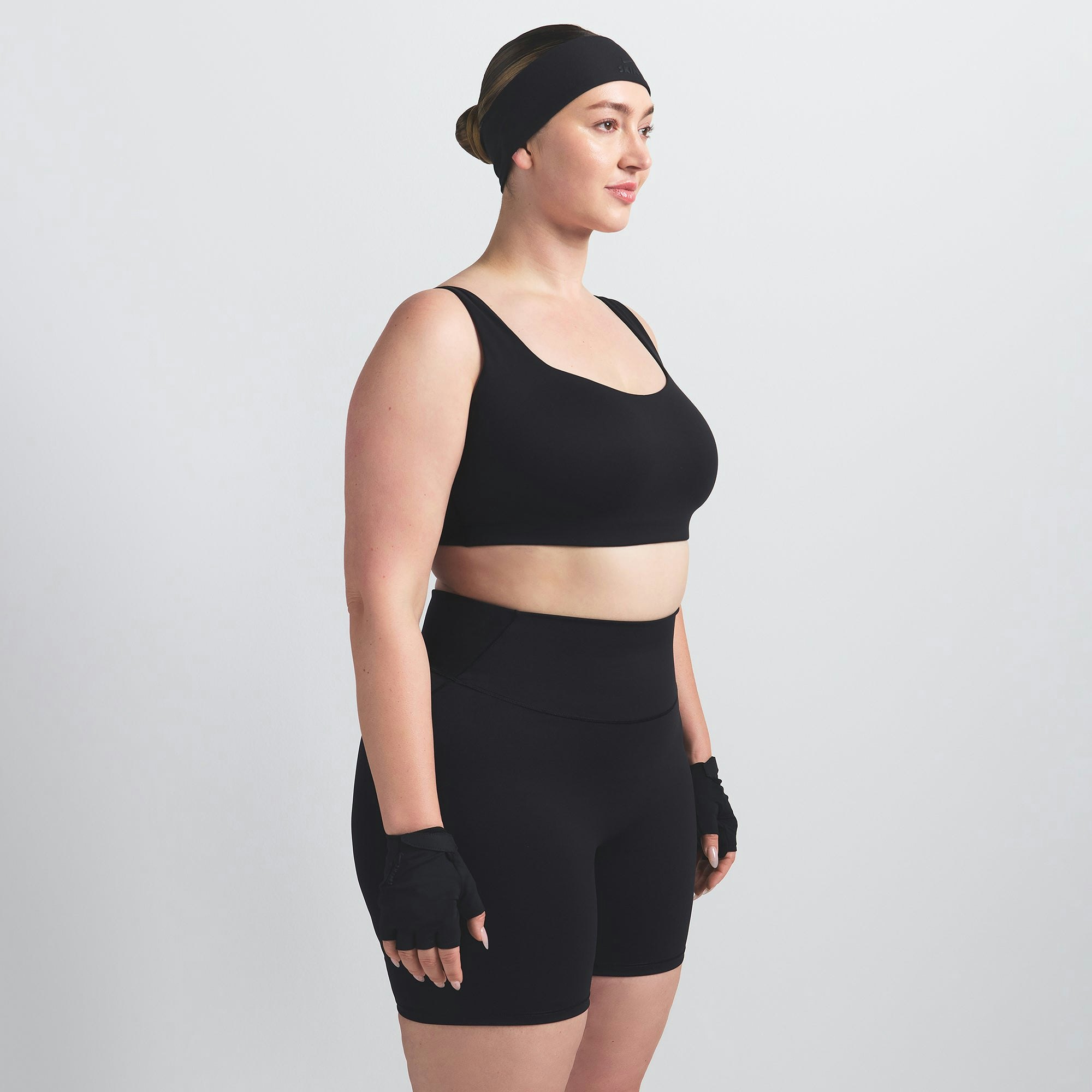 NikeSKIMS MATTE 5" BIKER SHORT | OBSIDIAN ON A MODEL SIDE VIEW