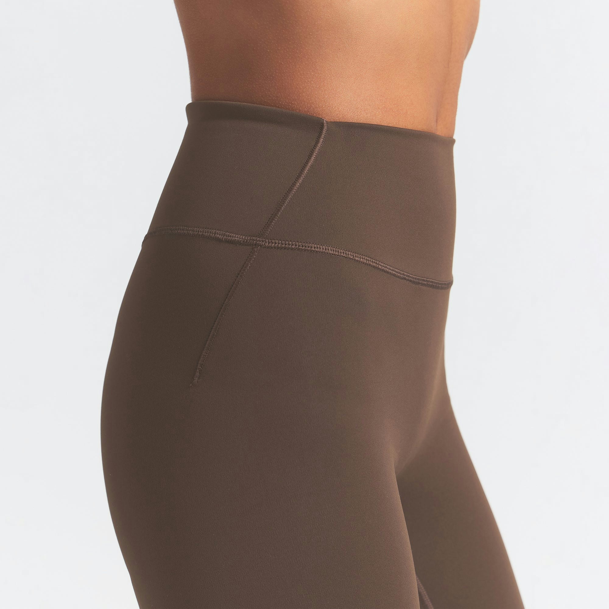 NikeSKIMS MATTE 7" BIKER SHORT | DARK SEPIA ON A MODEL SIDE VIEW