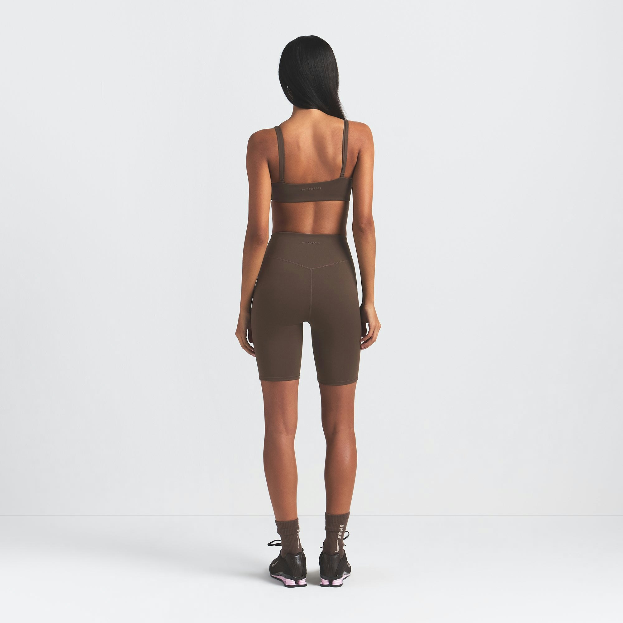 NikeSKIMS MATTE 7" BIKER SHORT | DARK SEPIA ON A MODEL BACK VIEW