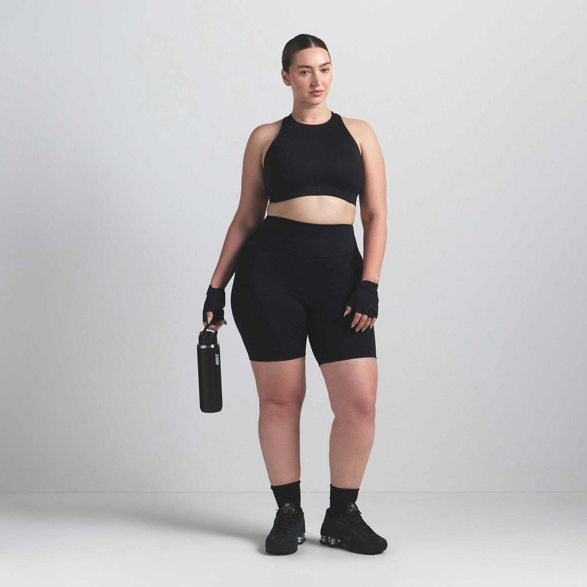 NikeSKIMS MATTE 7" BIKER SHORT | OBSIDIAN ON A MODEL FRONT VIEW