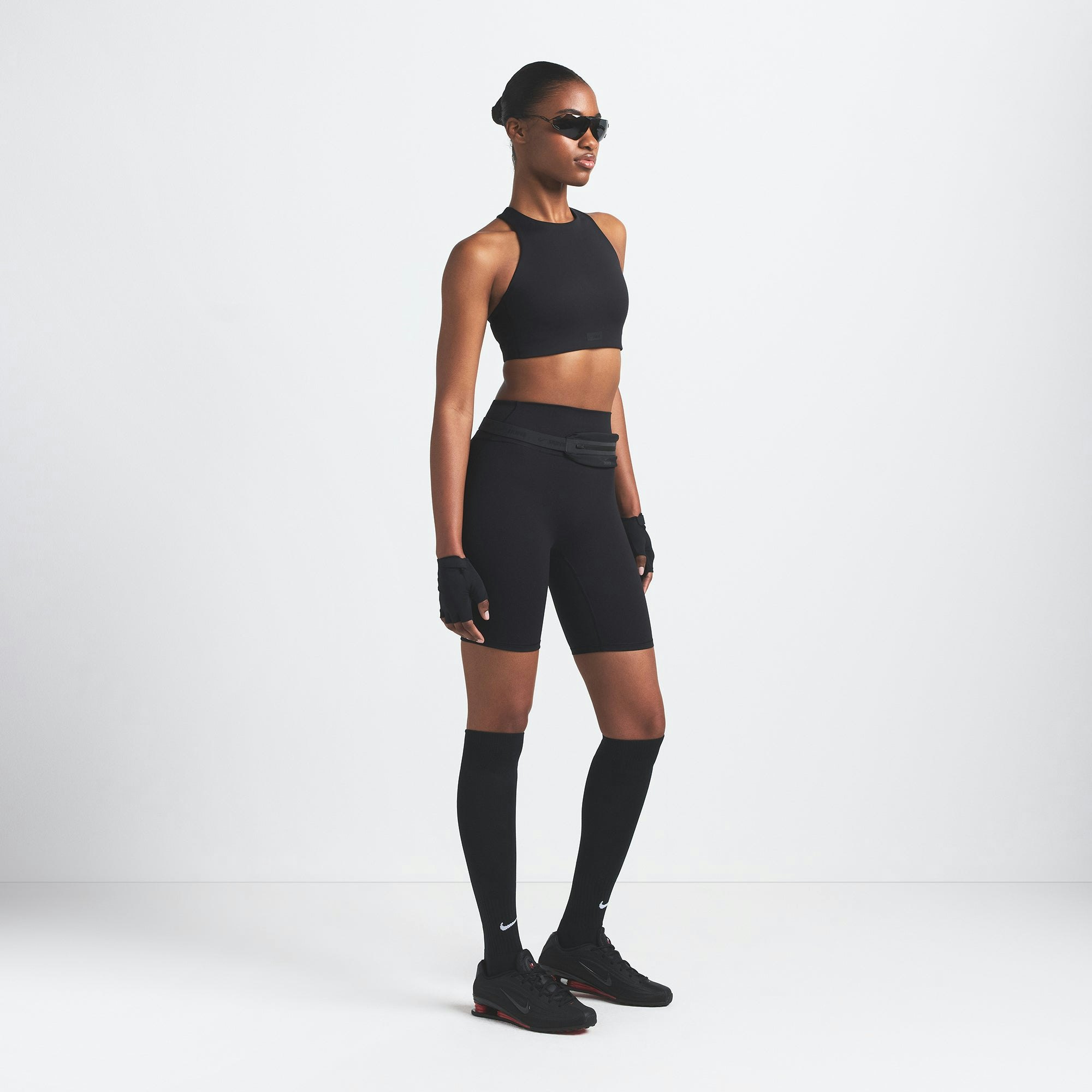 NikeSKIMS MATTE 7" BIKER SHORT | OBSIDIAN ON A MODEL FRONT VIEW