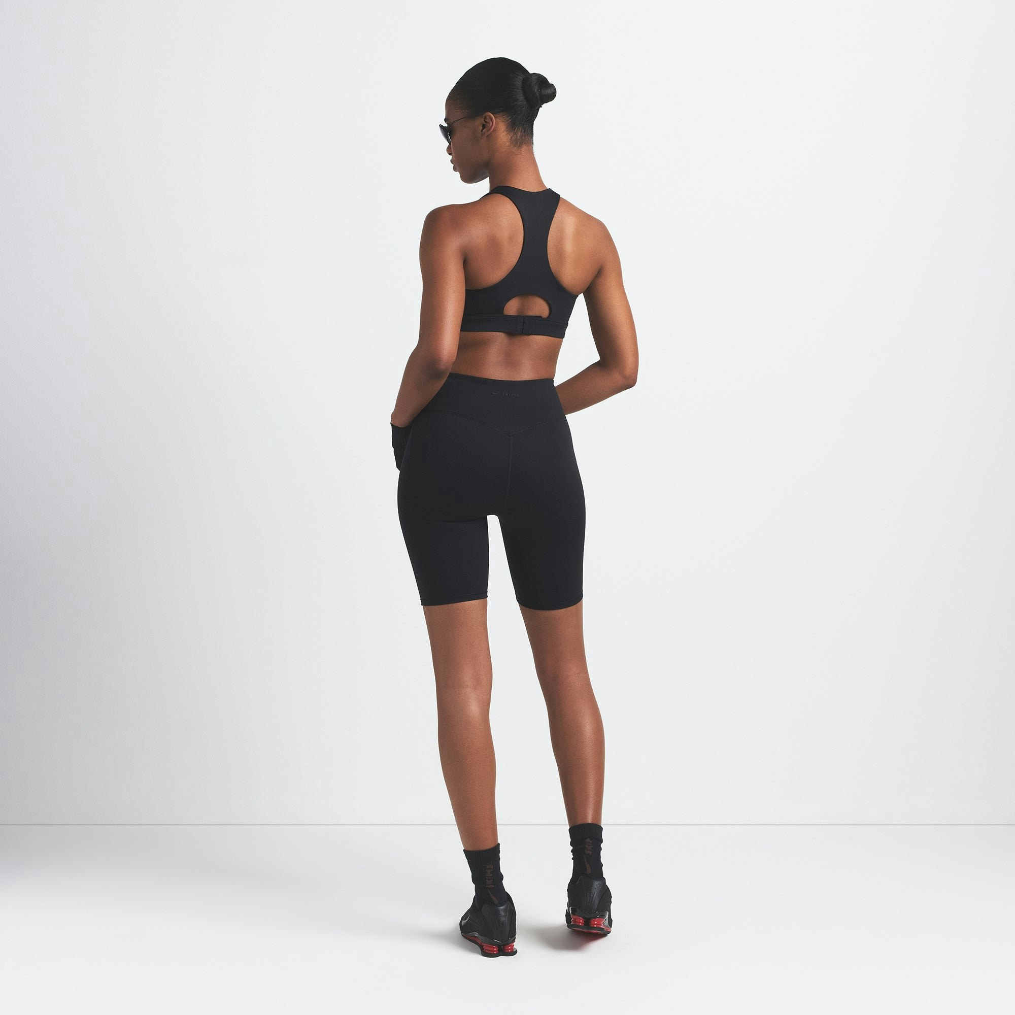NikeSKIMS MATTE 7" BIKER SHORT | OBSIDIAN ON A MODEL BACK VIEW