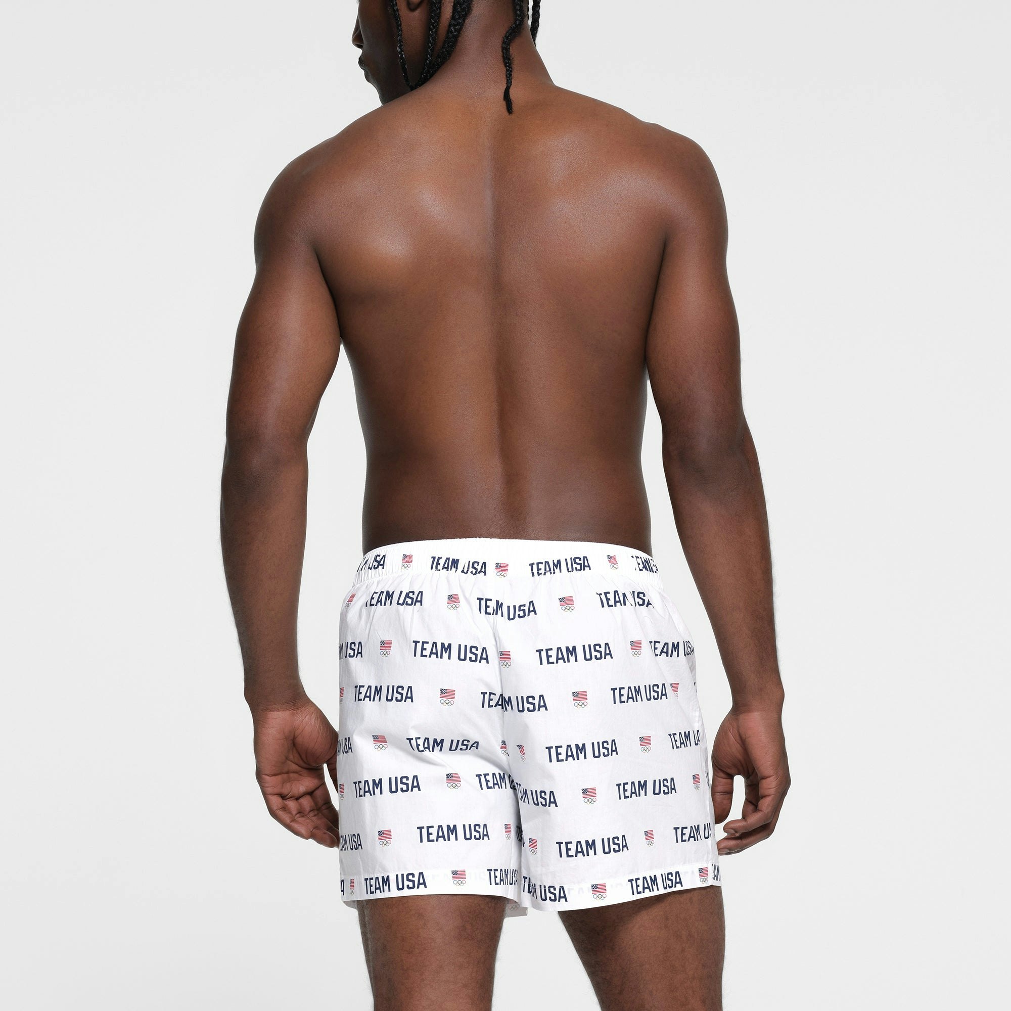 SKIMS FOR TEAM USA COTTON POPLIN SLEEP MENS OLYMPIC BOXER | WHITE ON A MODEL BACK VIEW