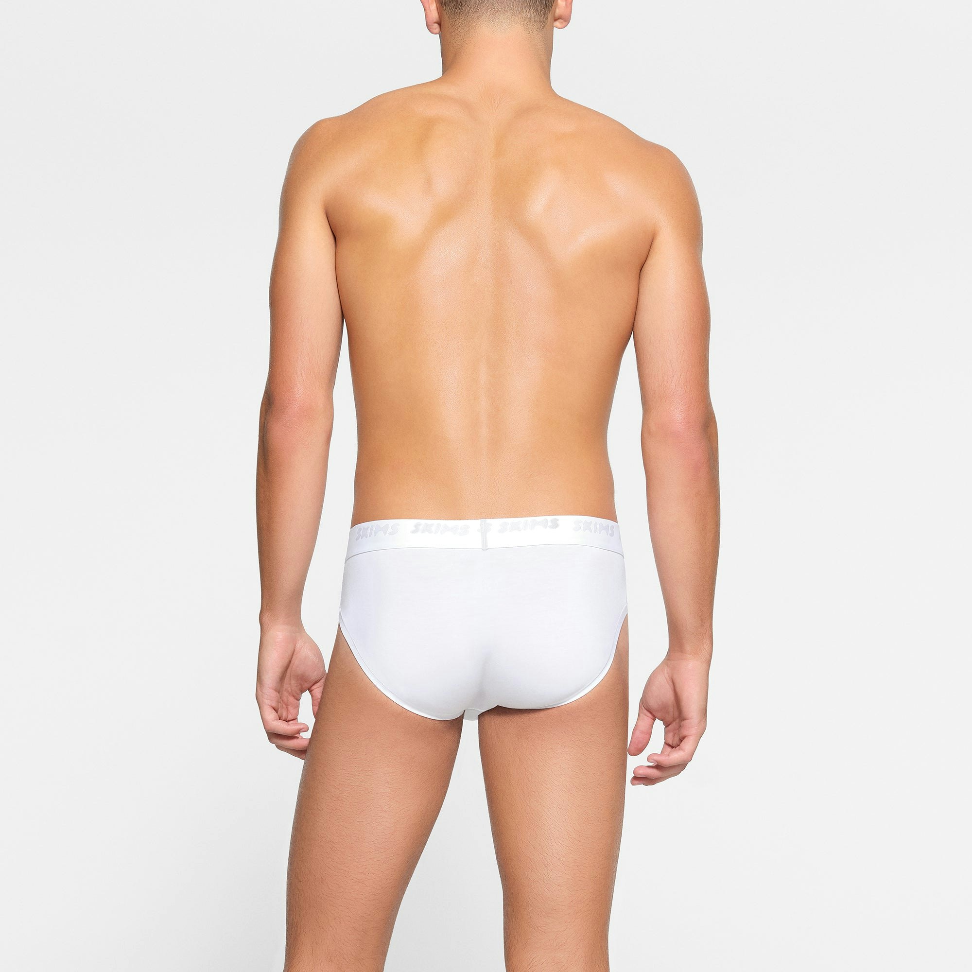 SKIMS STRETCH MENS BRIEF 3-PACK ON A MODEL BACK VIEW
