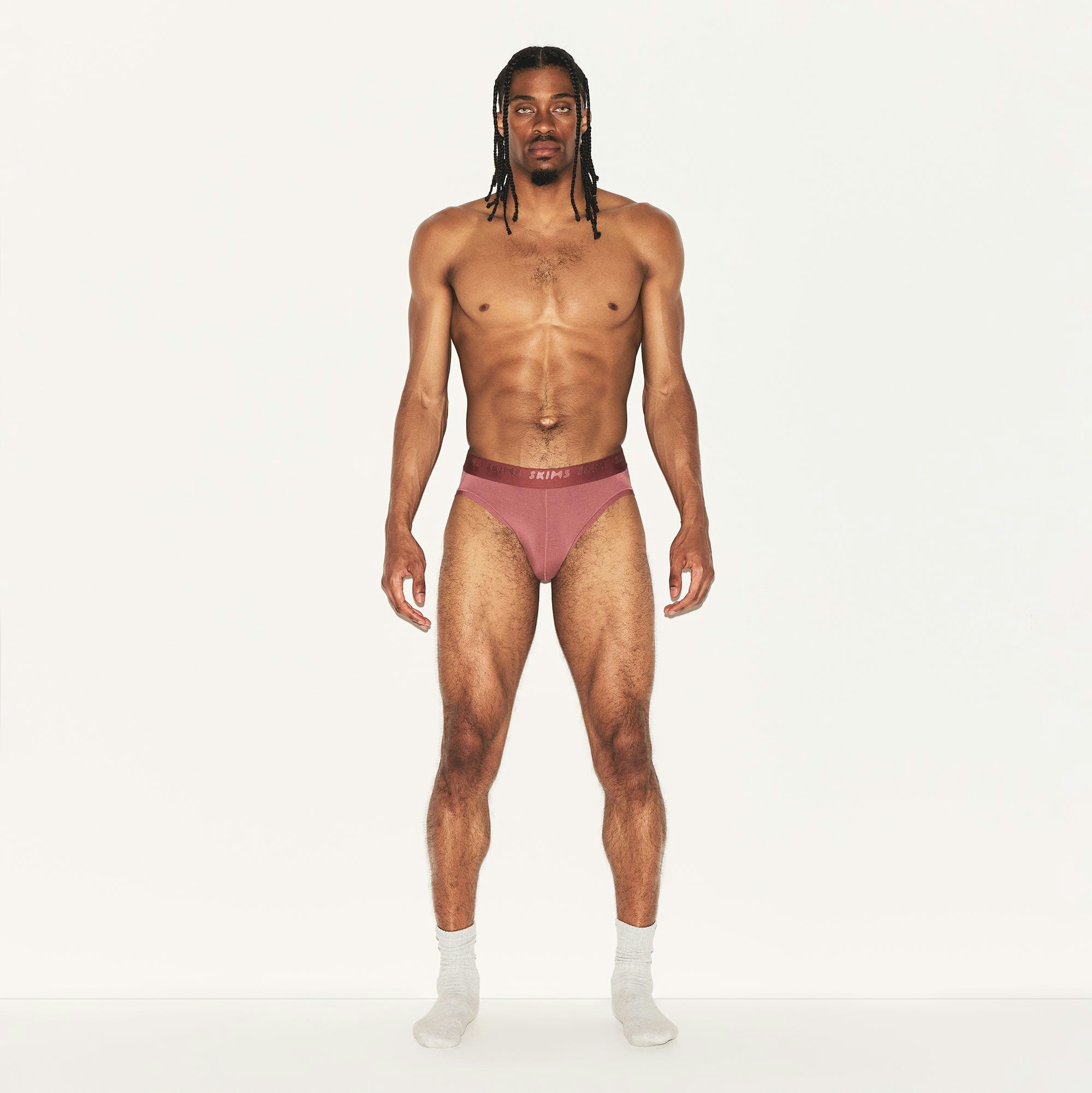 SKIMS STRETCH MENS BRIEF | CORDOVAN ON A MODEL FRONT VIEW | FOCUS: 0.0, 1.0, 0.9