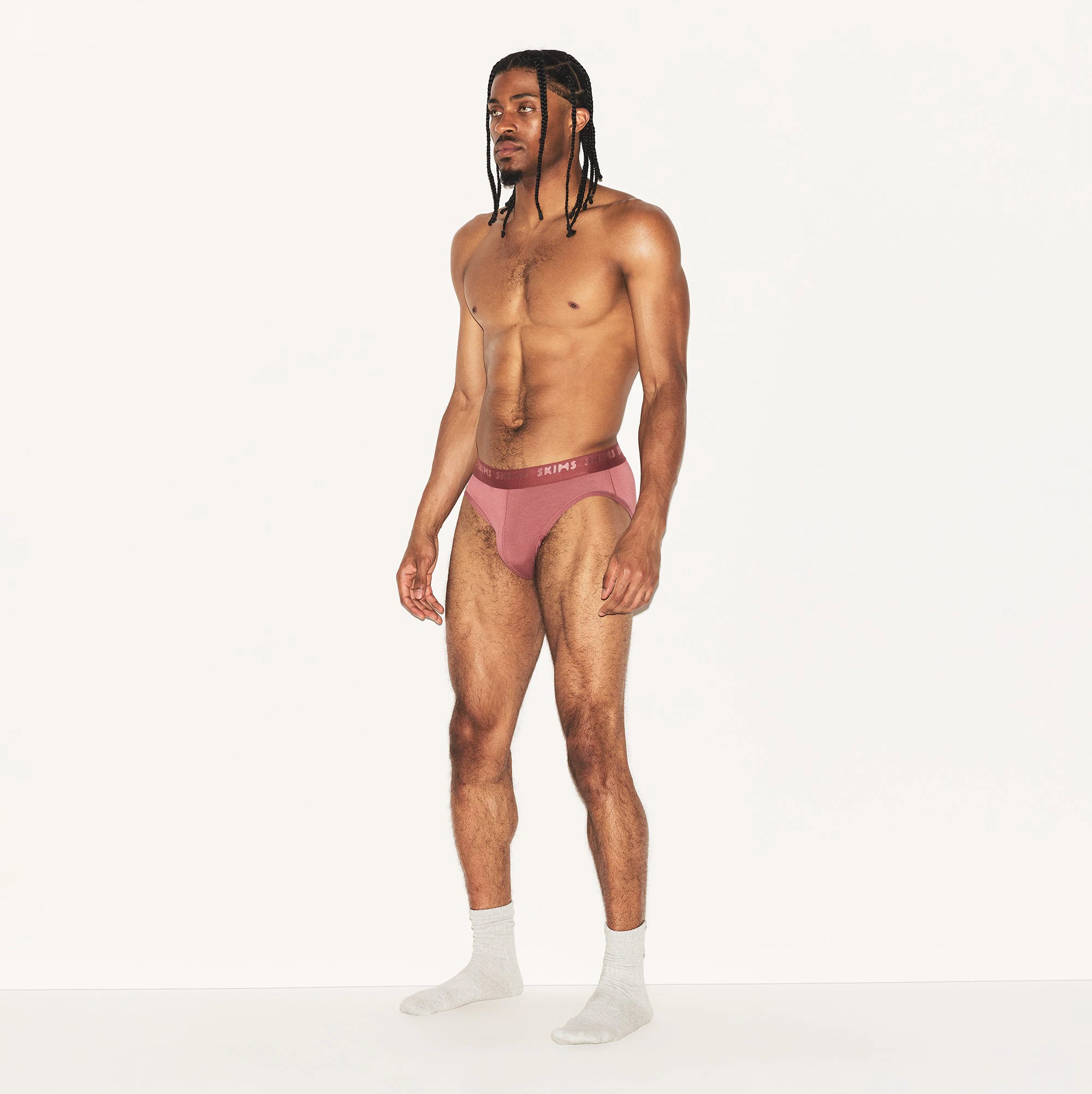 SKIMS STRETCH MENS BRIEF | CORDOVAN ON A MODEL SIDE VIEW | FOCUS: 0.0, 1.0, 0.9