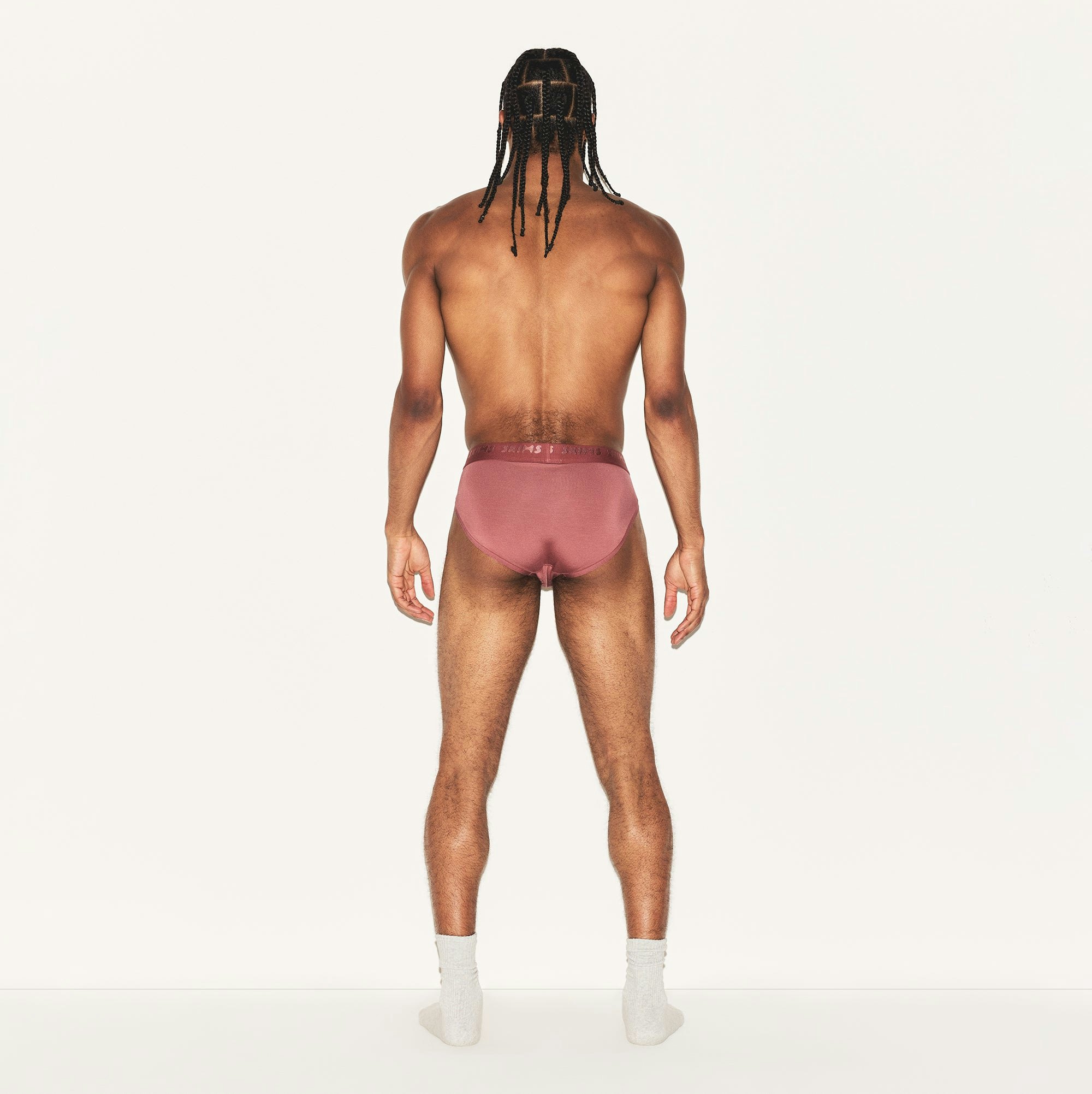 SKIMS STRETCH MENS BRIEF | CORDOVAN ON A MODEL BACK VIEW | FOCUS: 0.0, 1.0, 0.9