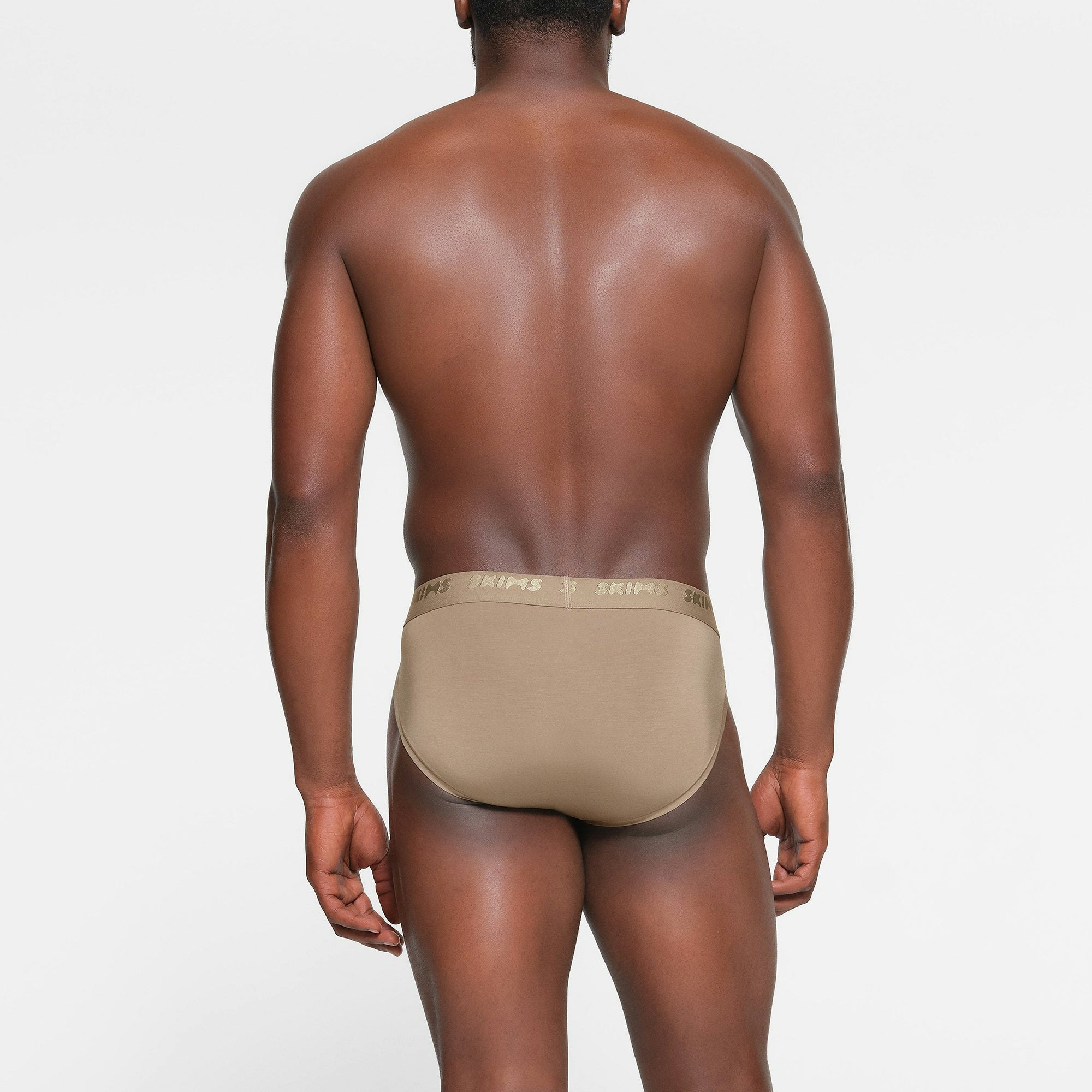 SKIMS STRETCH MENS BRIEF 3-PACK ON A MODEL BACK VIEW