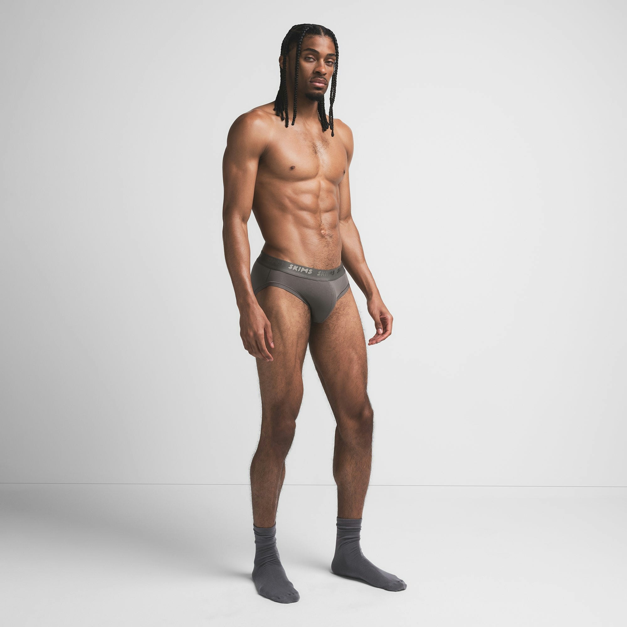 SKIMS STRETCH MENS BRIEF | GUNMETAL ON A MODEL SIDE VIEW @ | FOCUS: 0.9, 0.1, 0.7