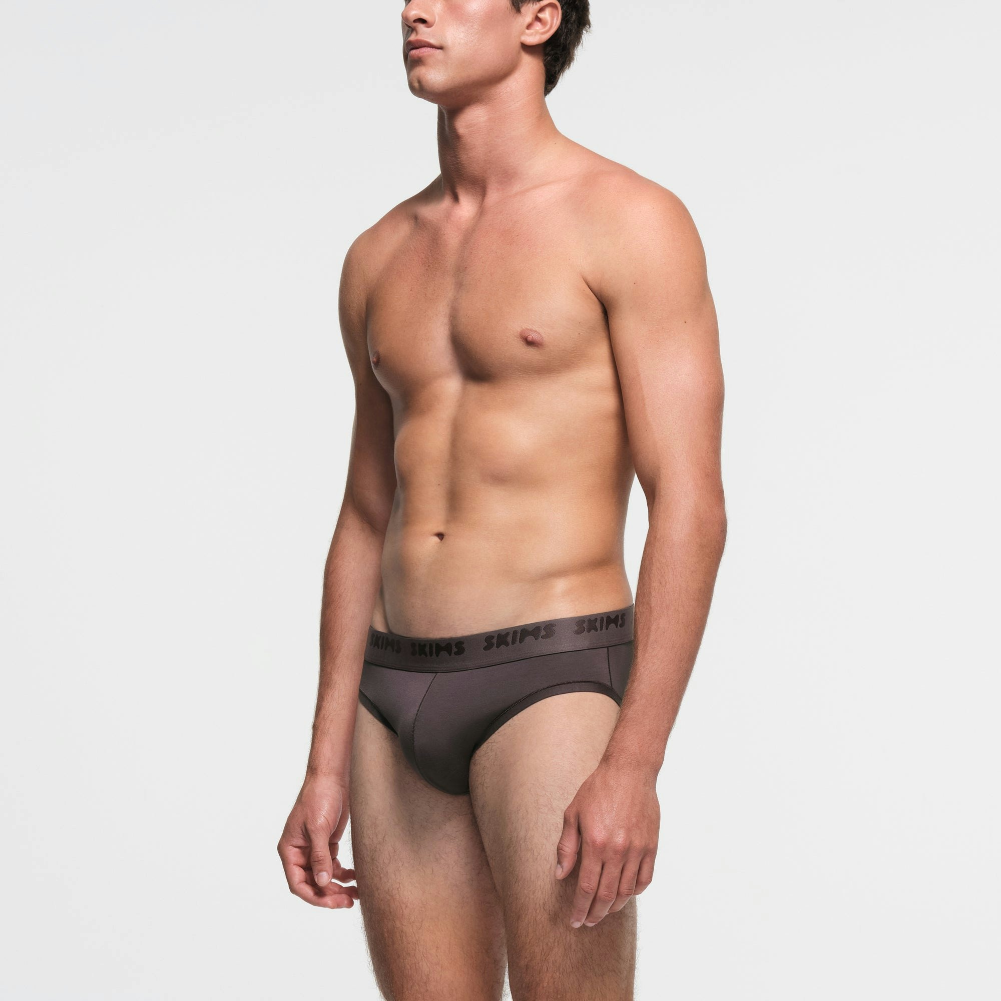 SKIMS STRETCH MENS BRIEF | IRON ON A MODEL SIDE VIEW
