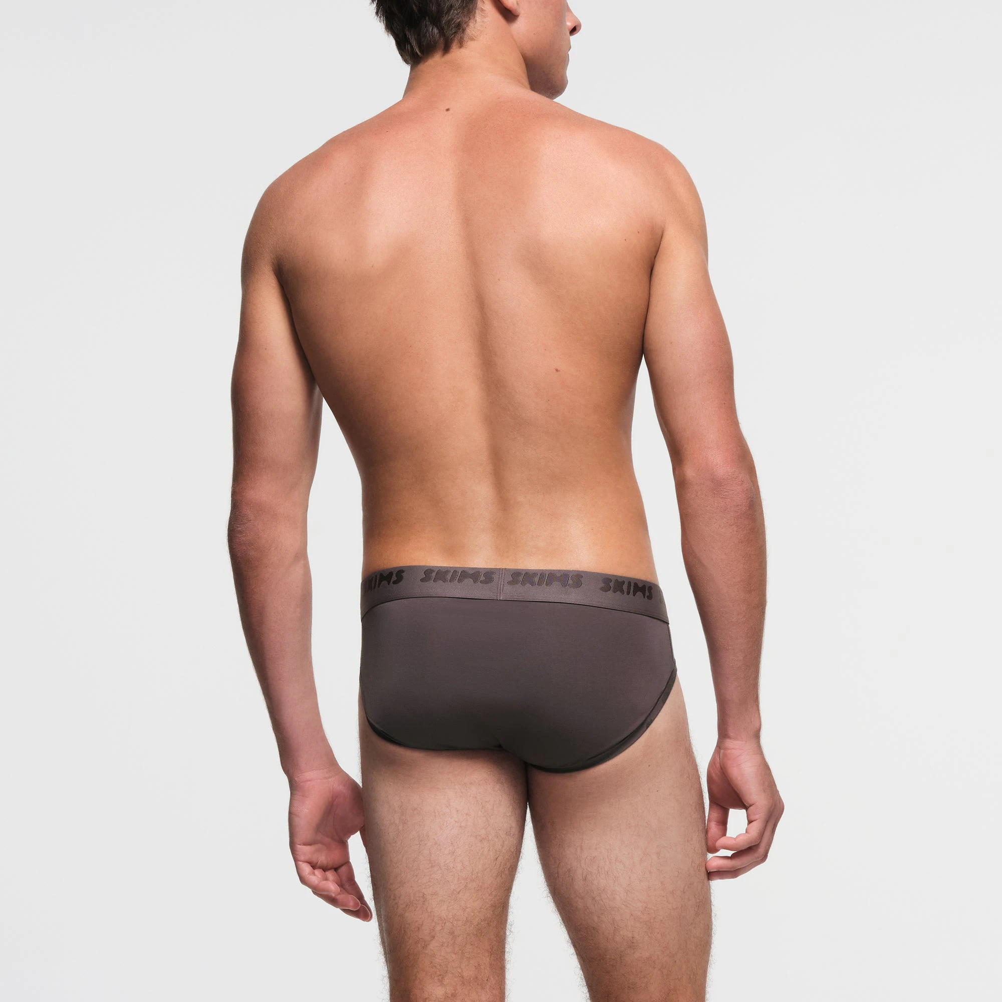 SKIMS STRETCH MENS BRIEF | IRON ON A MODEL BACK VIEW