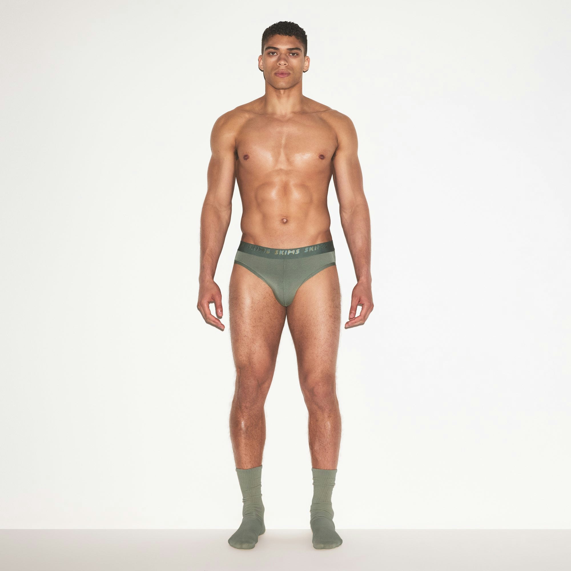SKIMS STRETCH MENS BRIEF | LAUREL ON A MODEL FRONT VIEW | FOCUS: 0.0, 1.0, 0.9