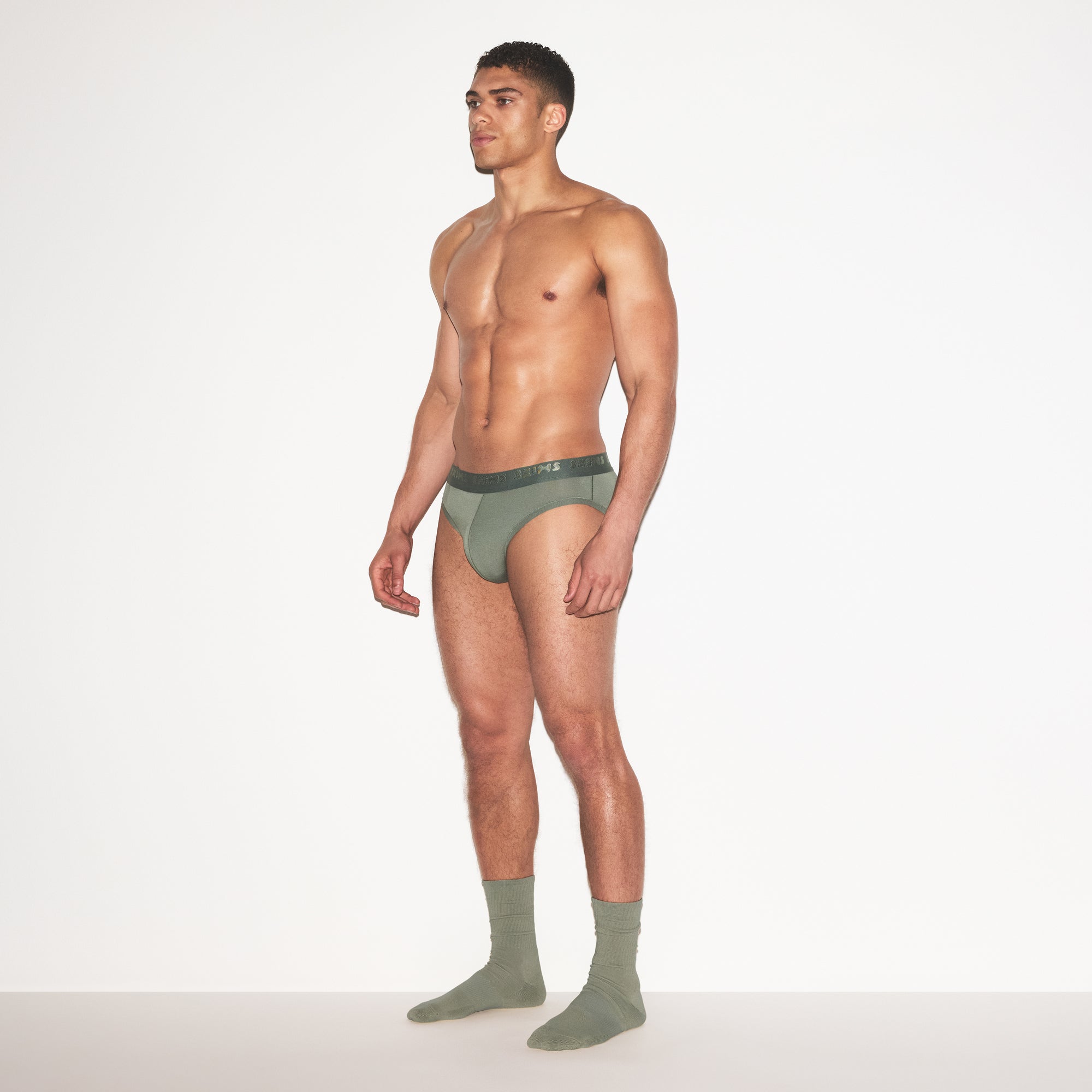 SKIMS STRETCH MENS BRIEF | LAUREL ON A MODEL FRONT VIEW | FOCUS: 0.0, 1.0, 0.9