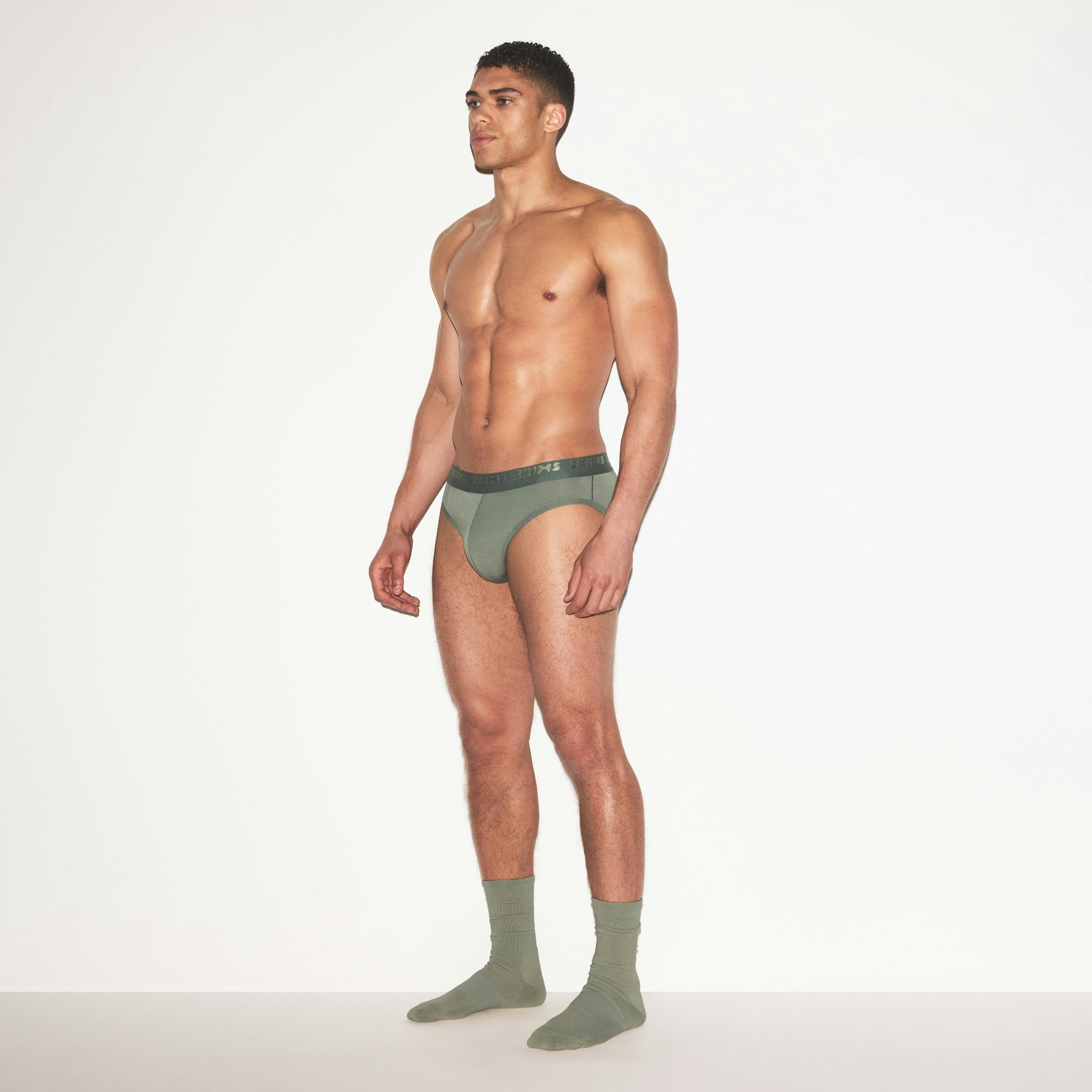 SKIMS STRETCH MENS BRIEF | LAUREL ON A MODEL FRONT VIEW | FOCUS: 0.0, 1.0, 0.9